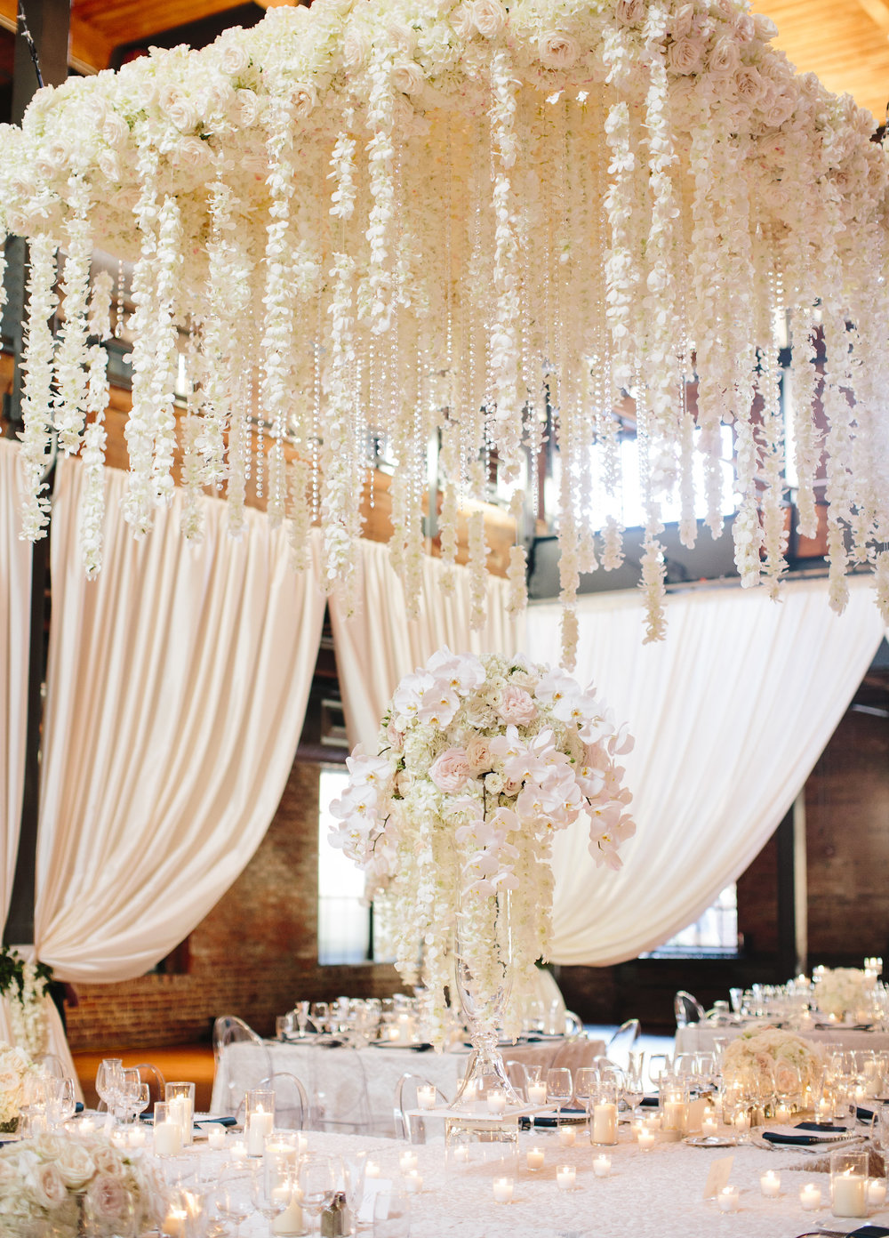 Stunning white floral cascade overhang over head table