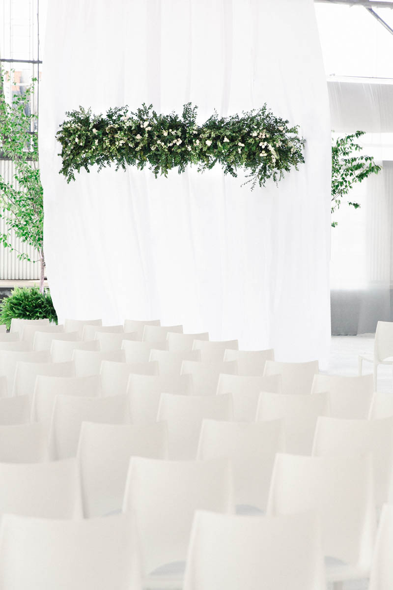 american-tobacco-campus-wedding-ceremony-white-chairs.jpg