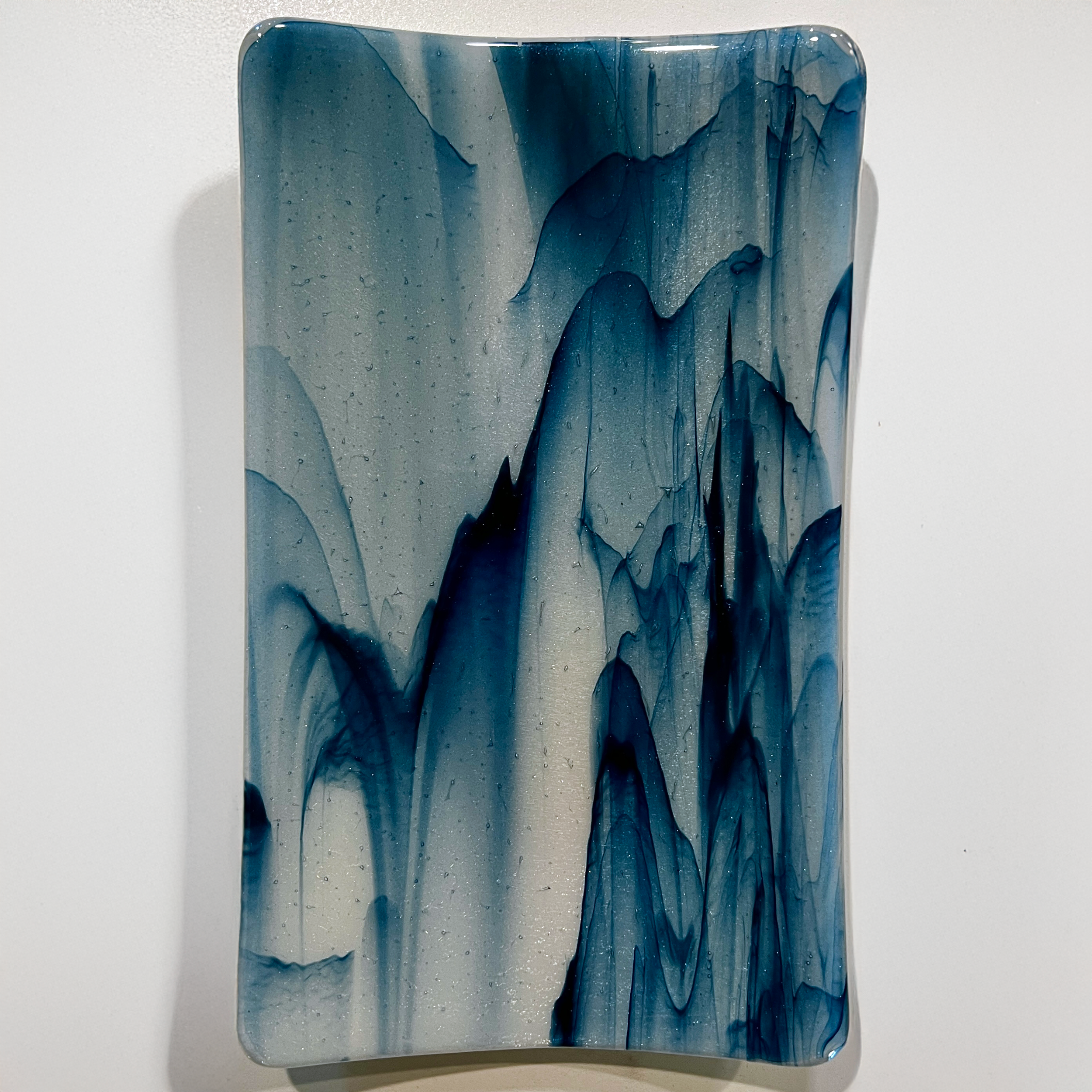MedTray-10x6-AdvenBlueStrkyIridPeachBase-April2026.png
