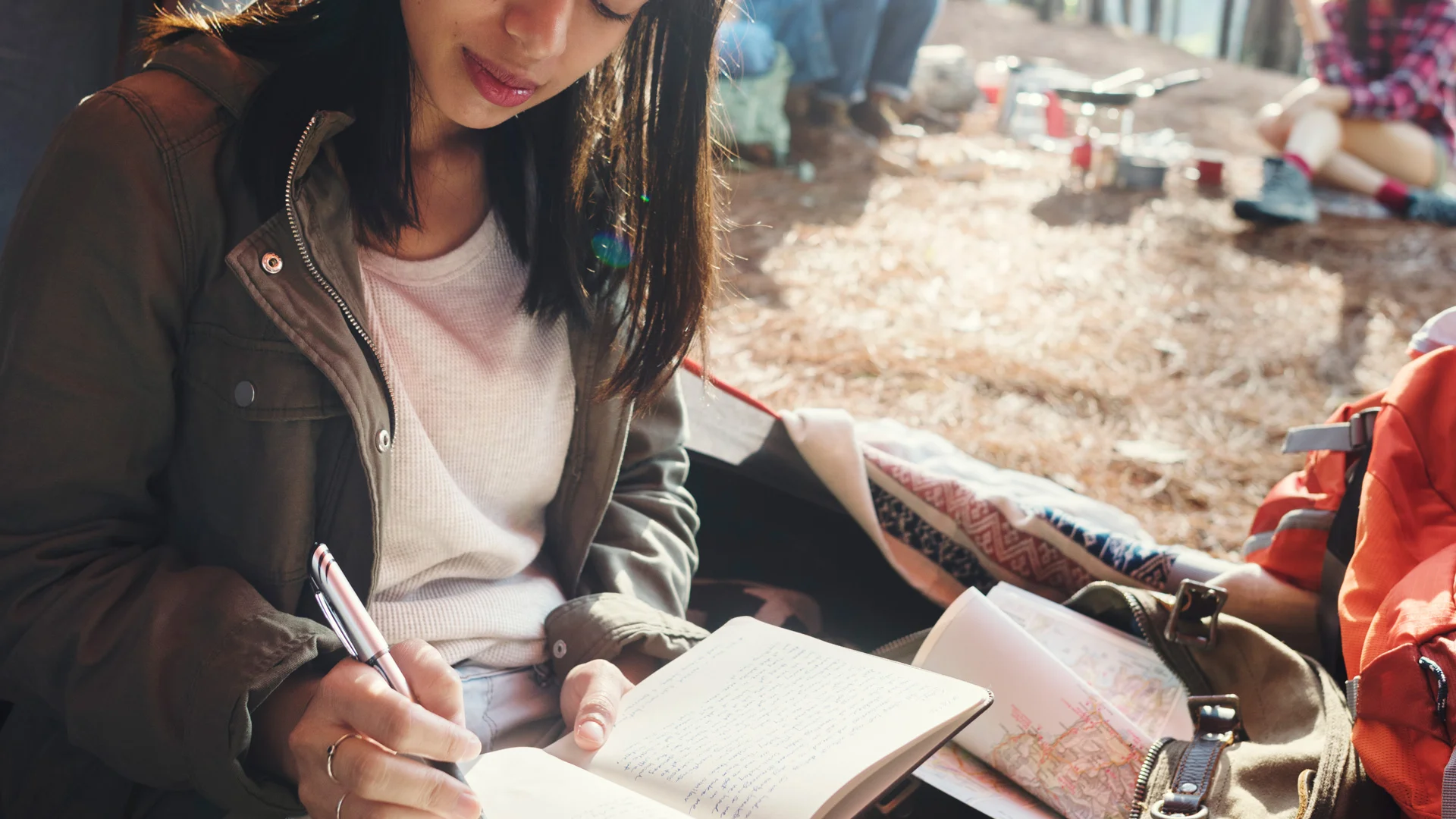woman-reading-traveling-destination-camping-P6QJNYP.jpg