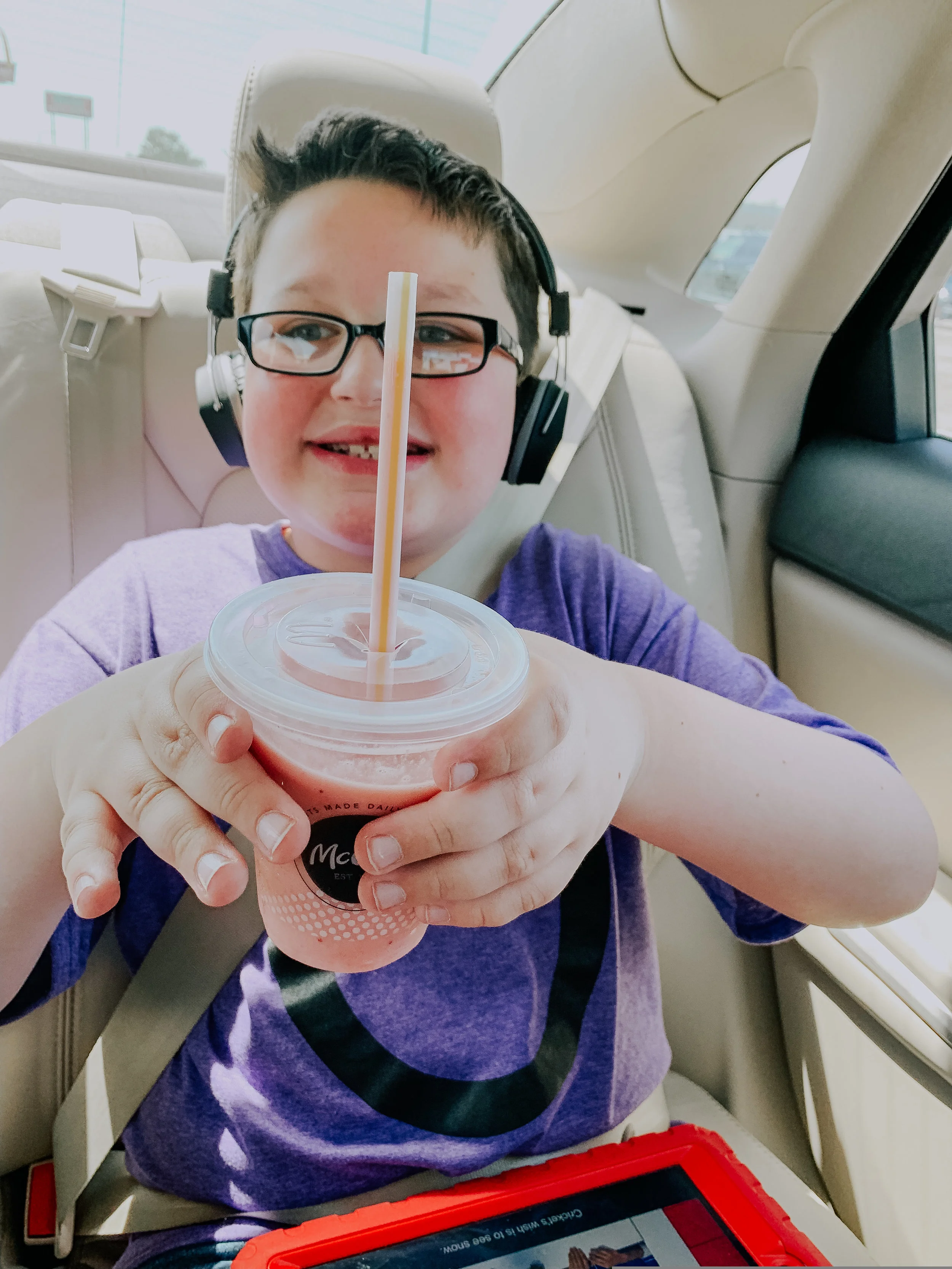 This photo is Owen in a nutshell in my mama eyes most days. This is us in the car on the way to see someone he loves, whether it's family, friends or therapists, with his favorite treat in hand and happily listening to his shows and music that make him so happy. In between all the other memories we make everywhere, there is simply this one to help hold them all together.