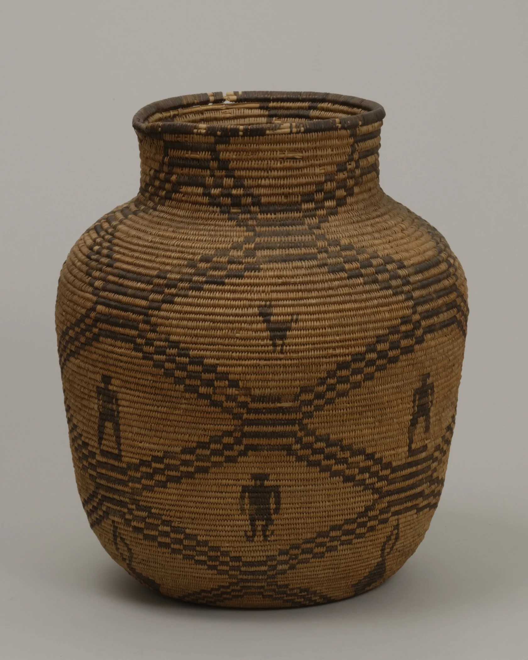 Western Apache, Arizona, jar-shaped basket, early 20th century. Willow, martynia, and cottonwood, 15 15/16 × 13 3/8 in. Hood Museum of Art, Dartmouth College: Gift of Miss Annah P. Hazen; 158.24.14208.