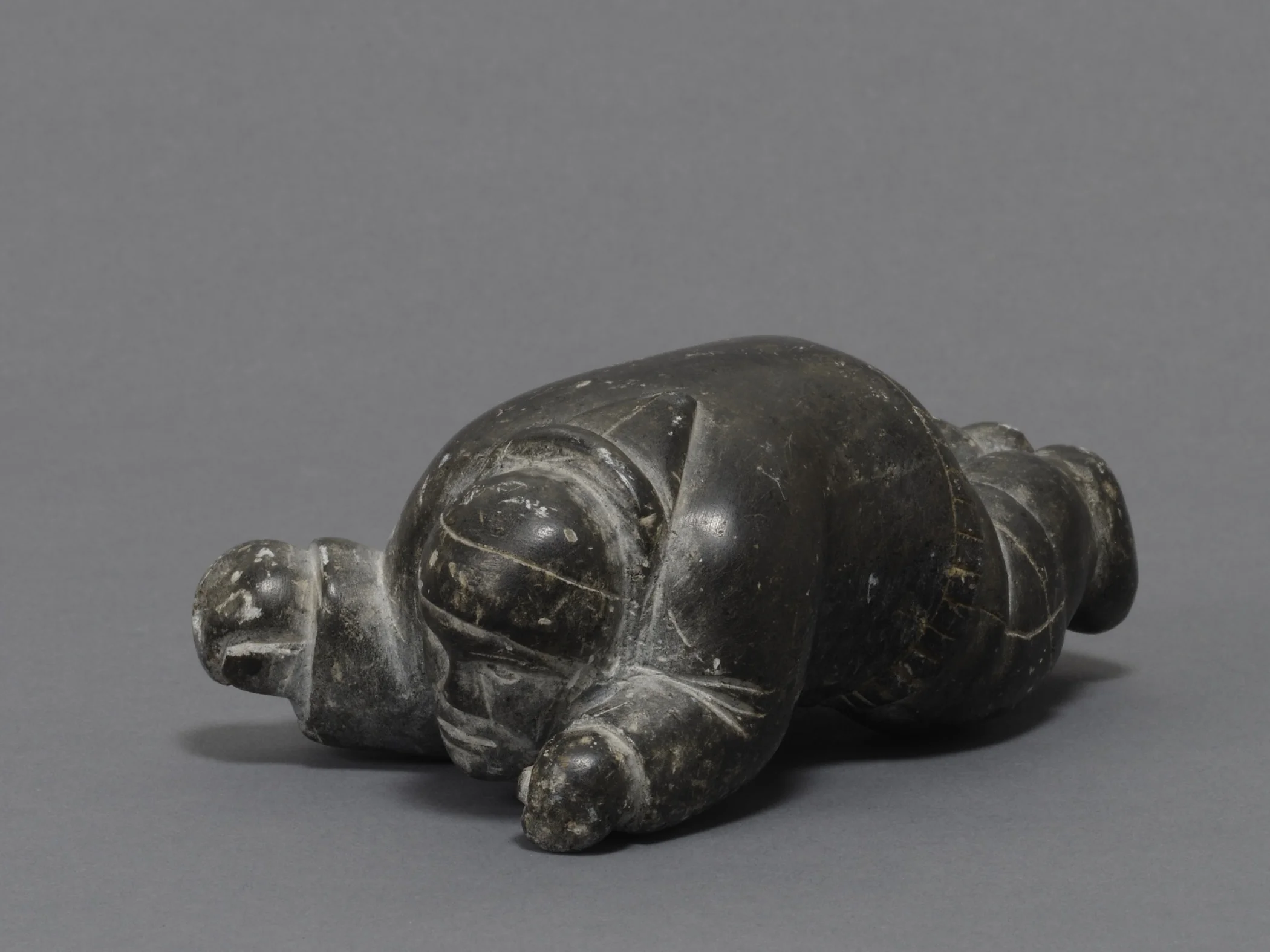 Canadian (Inuit), Inuk Creeping on His Belly to Surprise a Seal Basking on the Ice , about 1955. Steatite, 2 × 3 1/16 × 4 7/8 in. Hood Museum of Art, Dartmouth College: Gift of Willy E. Gorrissen; 179.17.25856.
