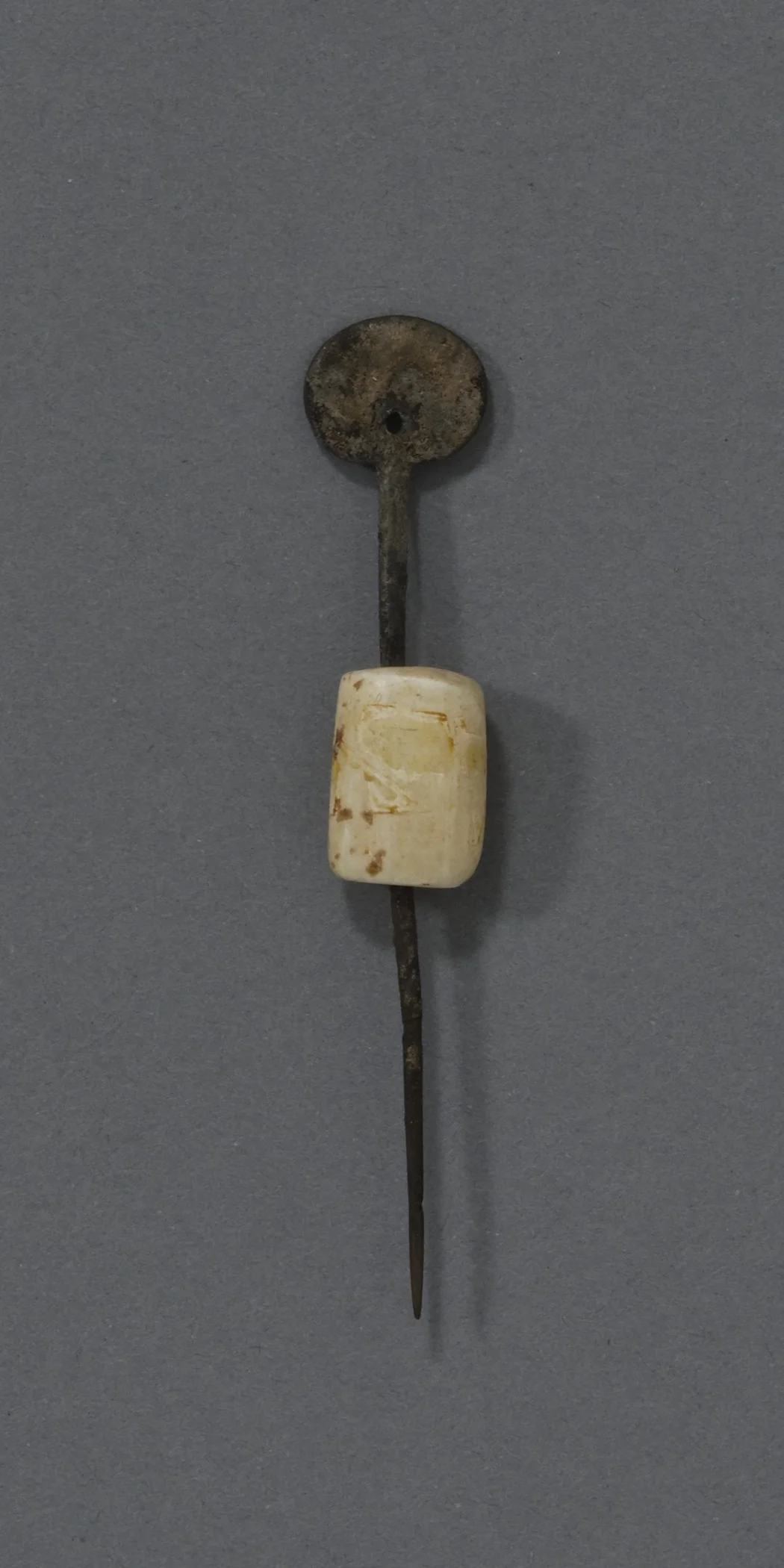 Kitlinermiut (Copper Inuit), woman’s sewing awl with a round bone guard, collected 1953–62. Copper and bone, height: 3 15/16 in. Hood Museum of Art, Dartmouth College: Sherman P. and Anne L. Haight Arctic Collection; 168.94.24463.