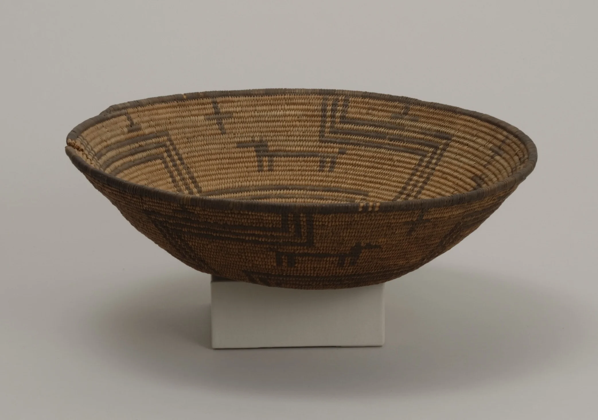 Western Apache, basket, early 20th century. Willow, cottonwood, and devil’s claw, 3 3/4 × 14 in. Hood Museum of Art, Dartmouth College: Gift of Capt. Herbert L. Shuttleworth II, Class of 1935; 43.25.8621.