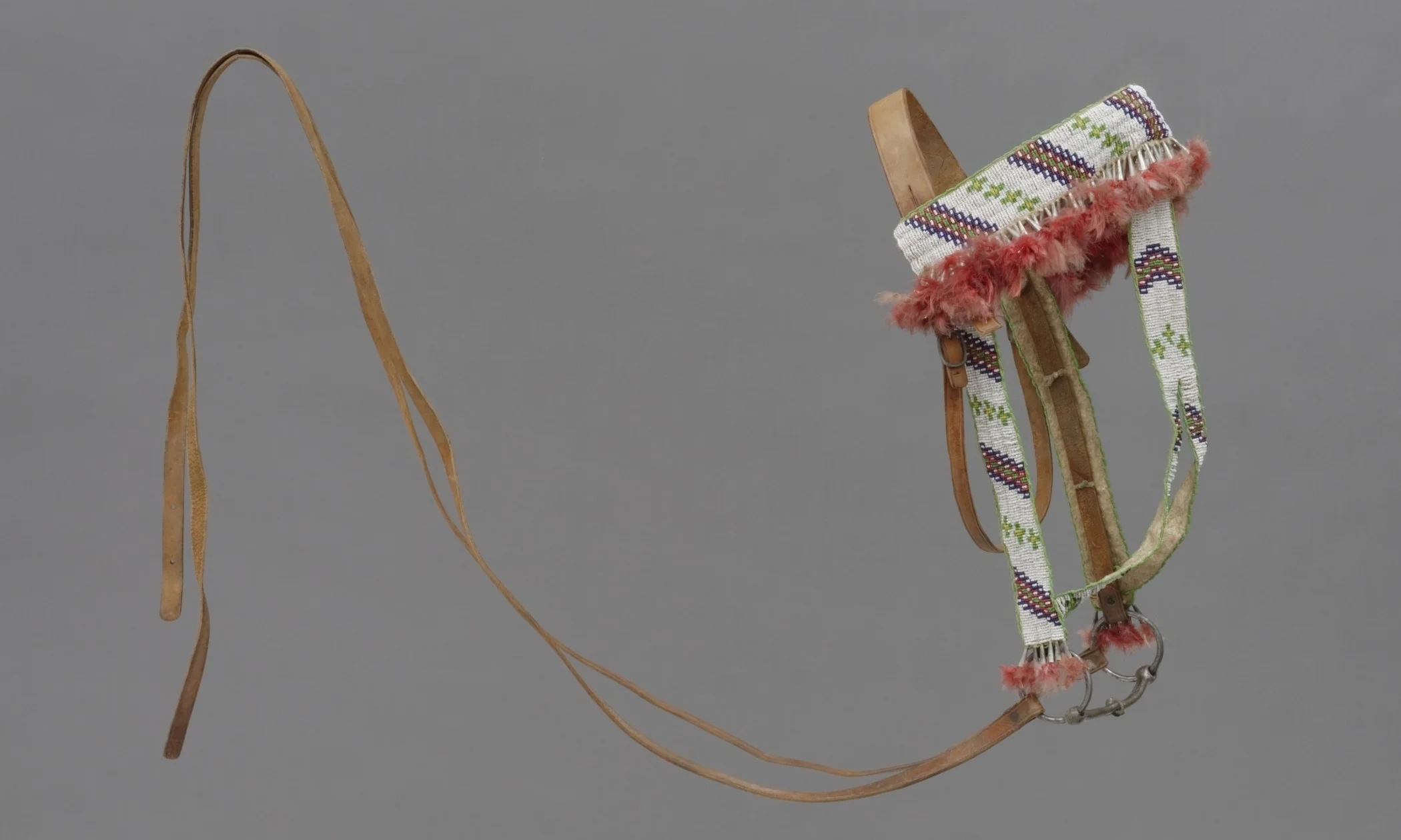 Sioux, beaded leather bridle, collected about 1908. Iron, leather, beads, tin, and feathers. Hood Museum of Art, Dartmouth College: Bequest of Frank C. and Clara G. Churchill; 46.17.9836.