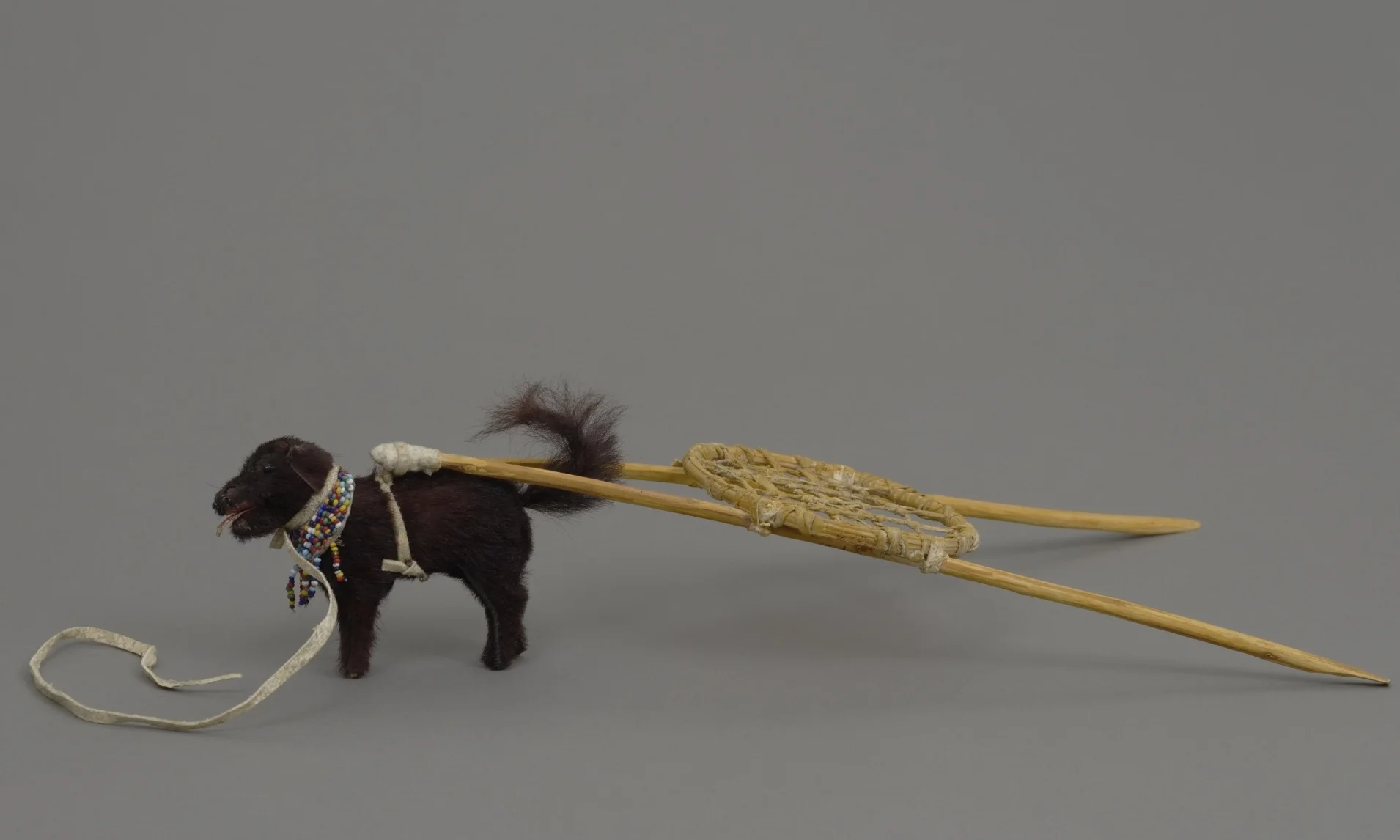 Sioux, figure of a Sioux dog and travois, 1957. Fur, glass trade beads, wood, and string leather, 3 9/16 × 1 1/8 × 5 5/8 in., 7 1/8 × 13 9/16 in. Hood Museum of Art, Dartmouth College: The Wellington Indian Doll Collection, Gift of Barbara Wellington Wells; 987.35.26828.