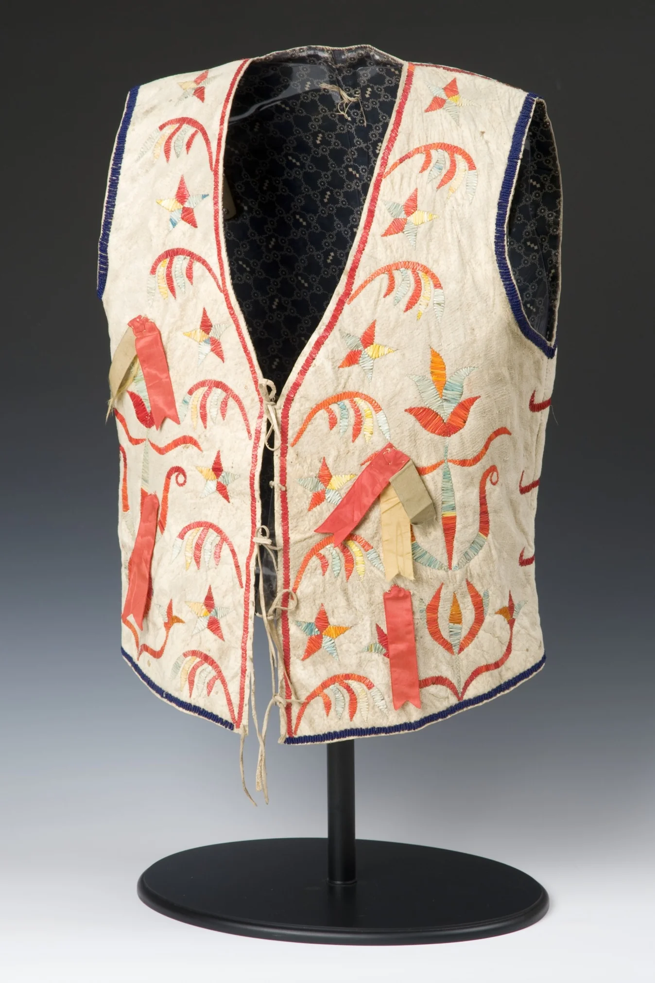 Dakota (Eastern Sioux), vest, about 1880. Native-tanned hide, cotton fabric, porcupine quills, silk ribbons, glass beads, dye, ink, sinew, and thread, 22 1/16 × 13 3/8 in. Hood Museum of Art, Dartmouth College: Gift of Stephen A. Lister, Class of 1963; 2008.82.