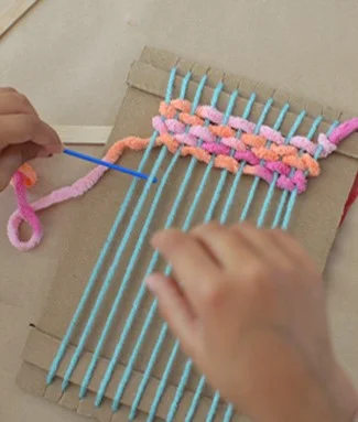 Image 32 Weaving on Loom.jpg