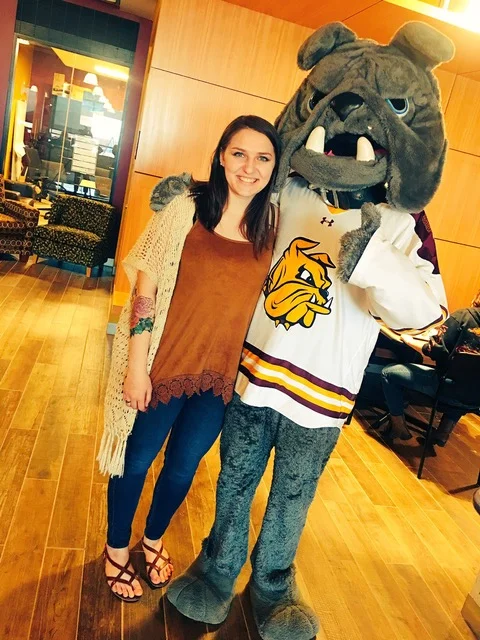 McDonald posing with our fearless mascot, Champ the Bulldog.