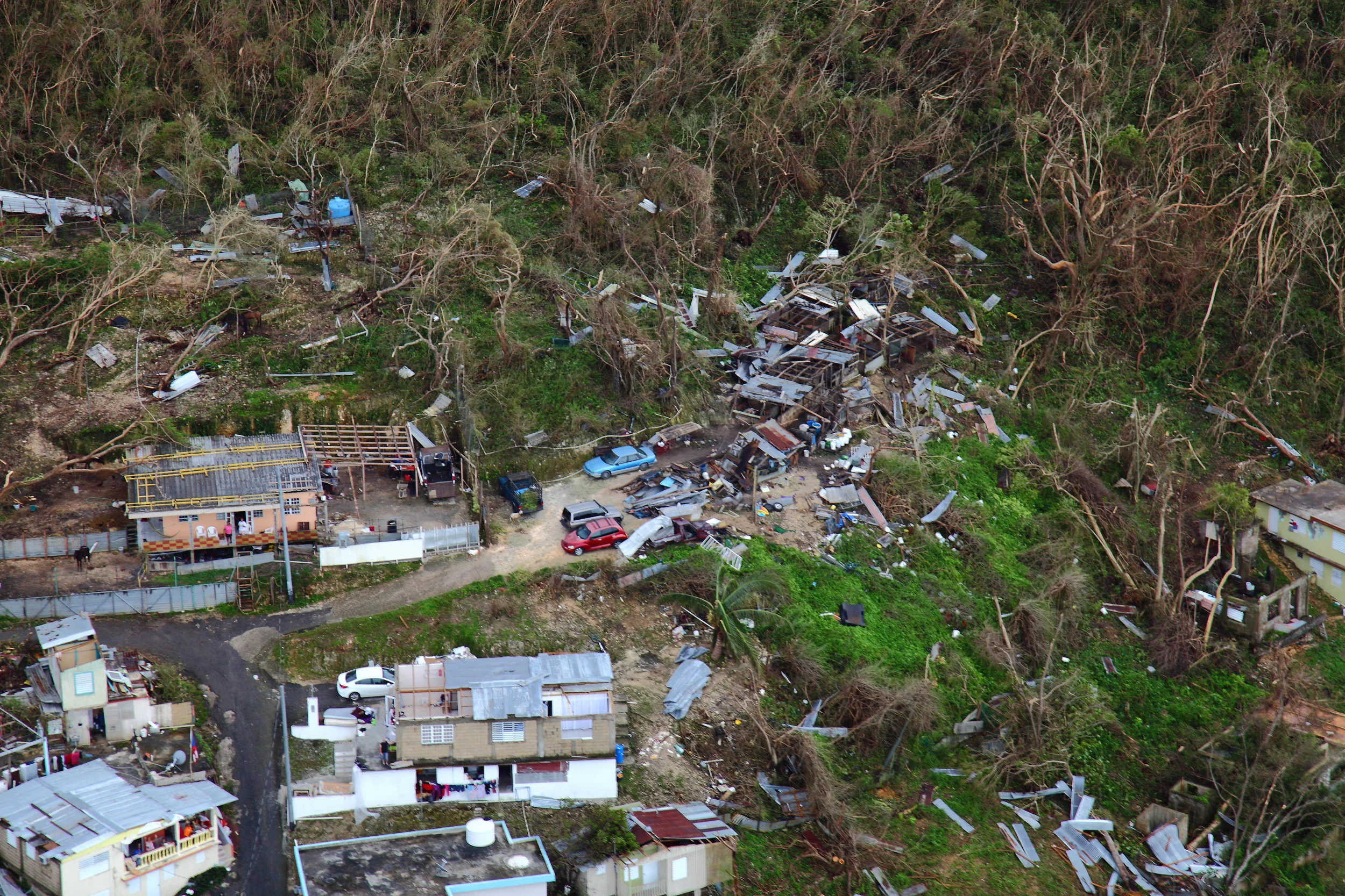 Homes lay in ruin as seen from a U.S. Customs and Border Protection, Air and Marine Operations, Black Hawk during a flyover of Puerto Rico after Hurricane Maria September 23, 2017. Photo by Kris Grogan .