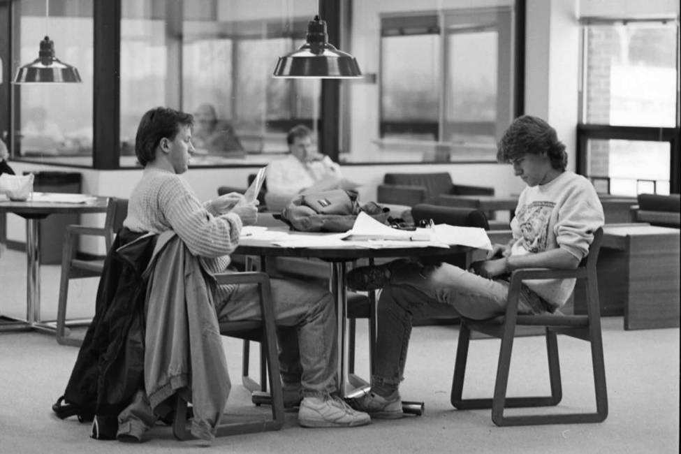 A couple UMD students get caught up on their studies. UMD didn't see a growth of the ODI until 1998 when a committee was established. Photo Courtesy of 19912_informal_kirby