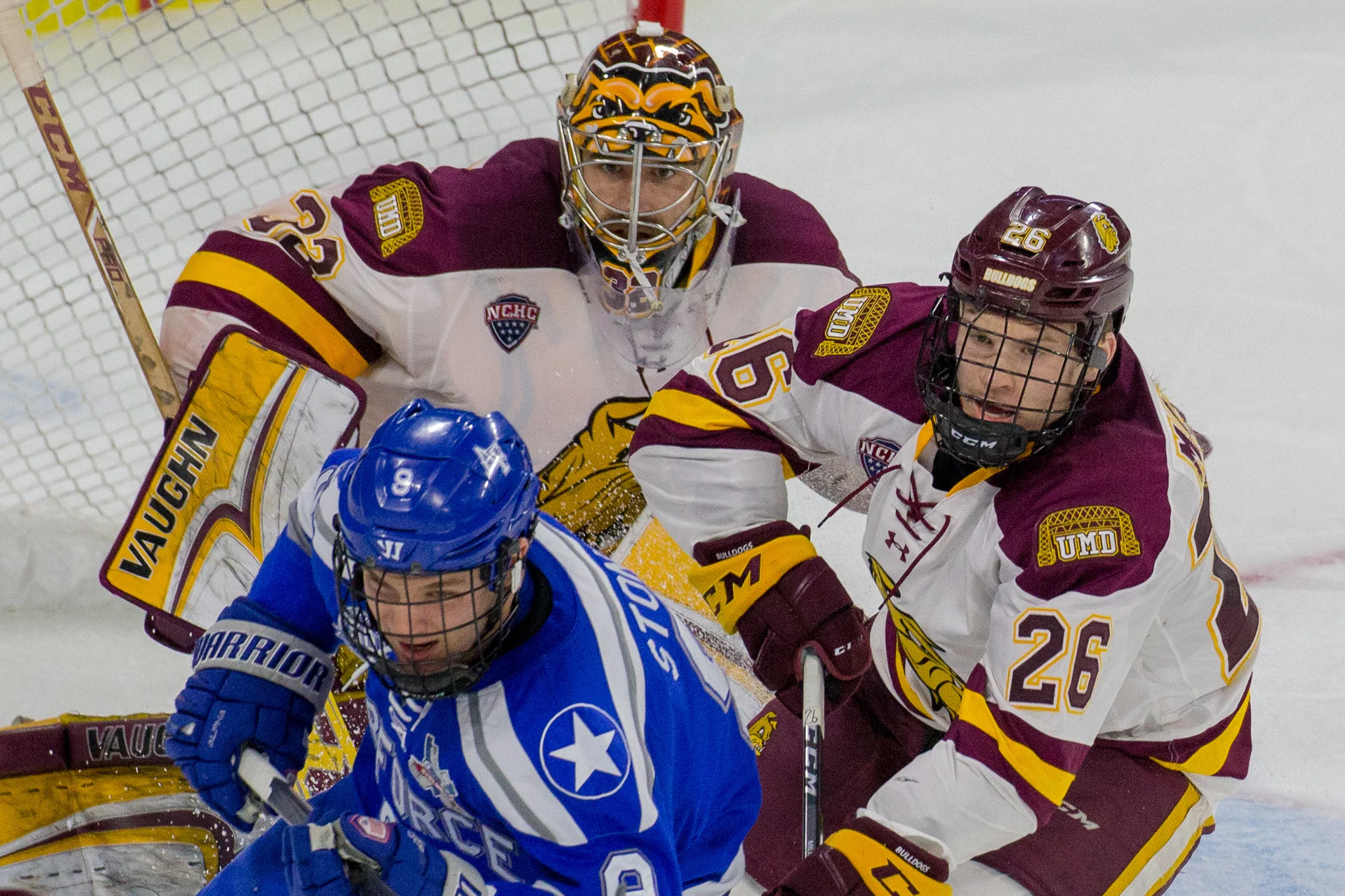 Jade Miller battles in front of the UMD net. Photo courtesy of Jim Rosvold