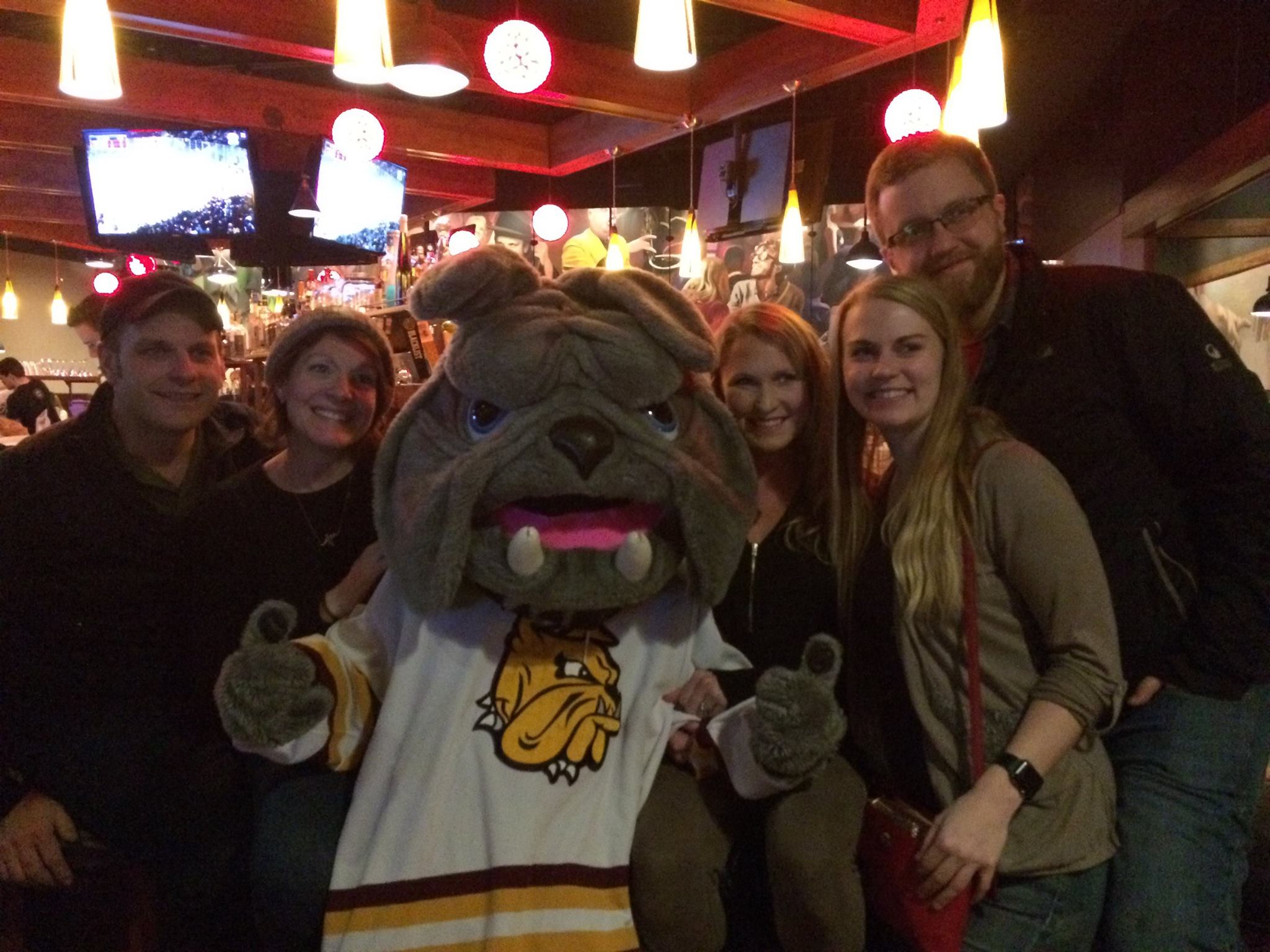 Champ meets with Bulldog fans during a frozen four watch party at Tavern on the Hill last spring Photo courtesy: UMD Alumni Relations