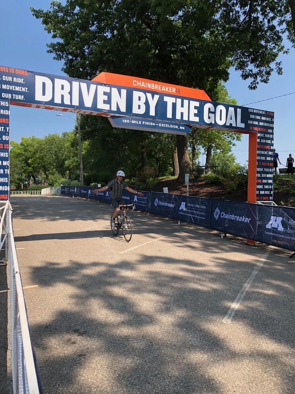 Professor in the College of Pharmacy, David Stenehjem, at the finish line for the Chainbreaker Ride on Aug. 12, 2018. Stenehjem rode all 180 miles on his bike for the Chainbreaker Ride for one of his many cancer fundraising events. Photo courtesy of David Stenehjem