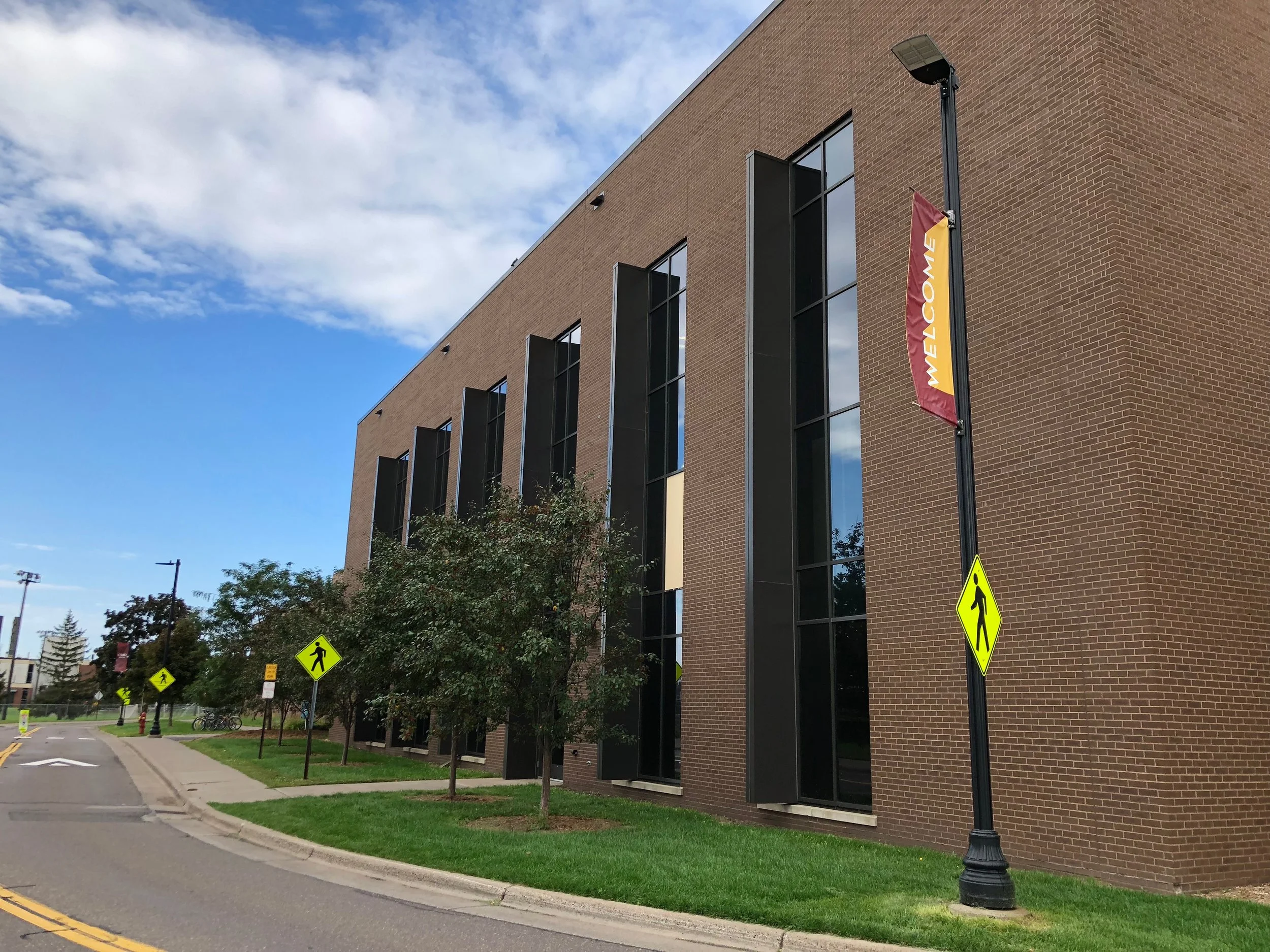 The Sports and Health Center on Sept. 6, 2018 where a first year student fell 12 feet. Glass from the window remains on the grass outside. Photo by Samantha Church