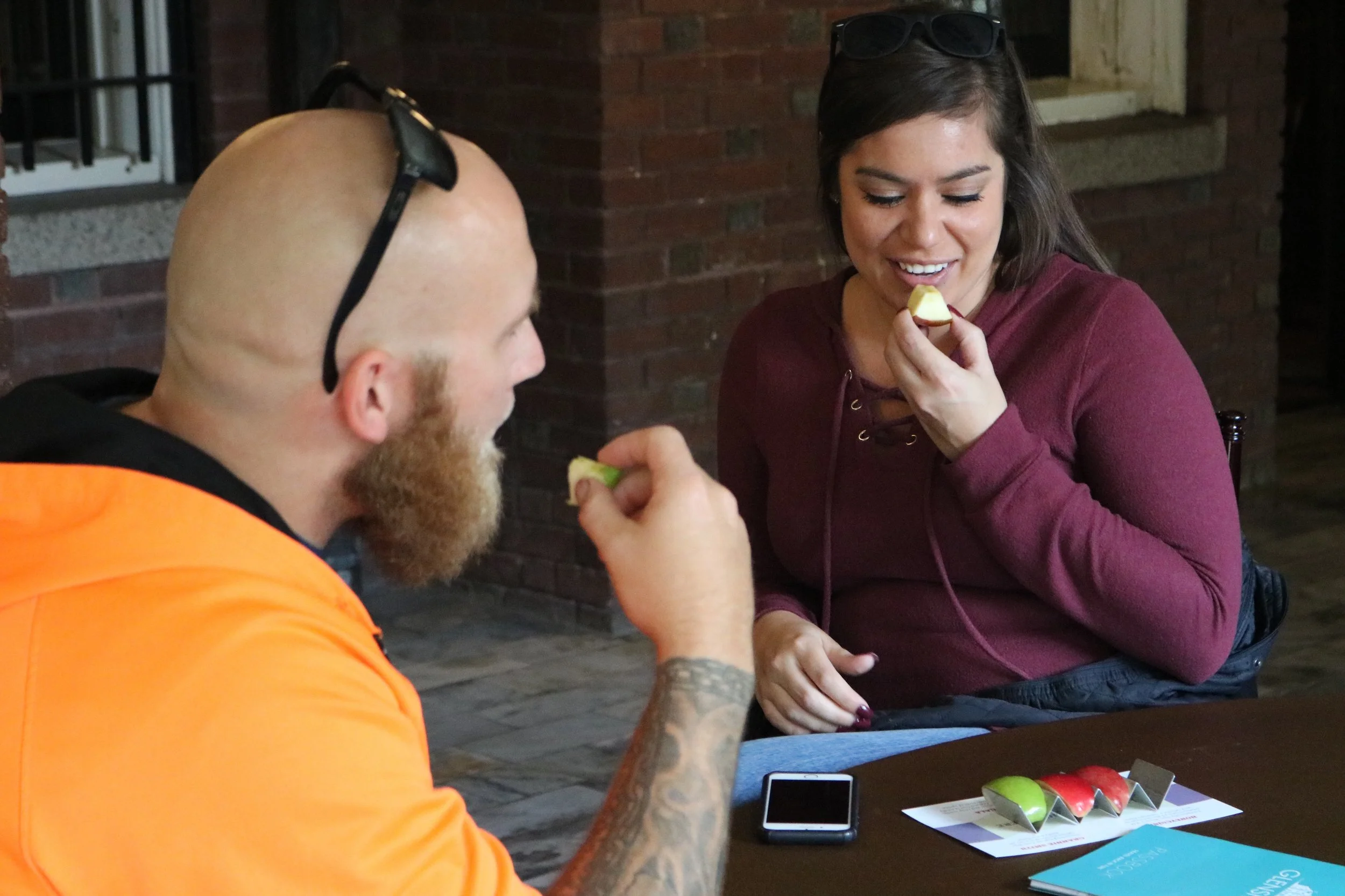 Glensheen visitor Melissa Paasch eating a flight of apples at the end of her tour on Sept. 30, 2018. Paasch is from Apple Valley, Minnesota, and Honeycrisp apples are her favorite. Photo by Zack Benz