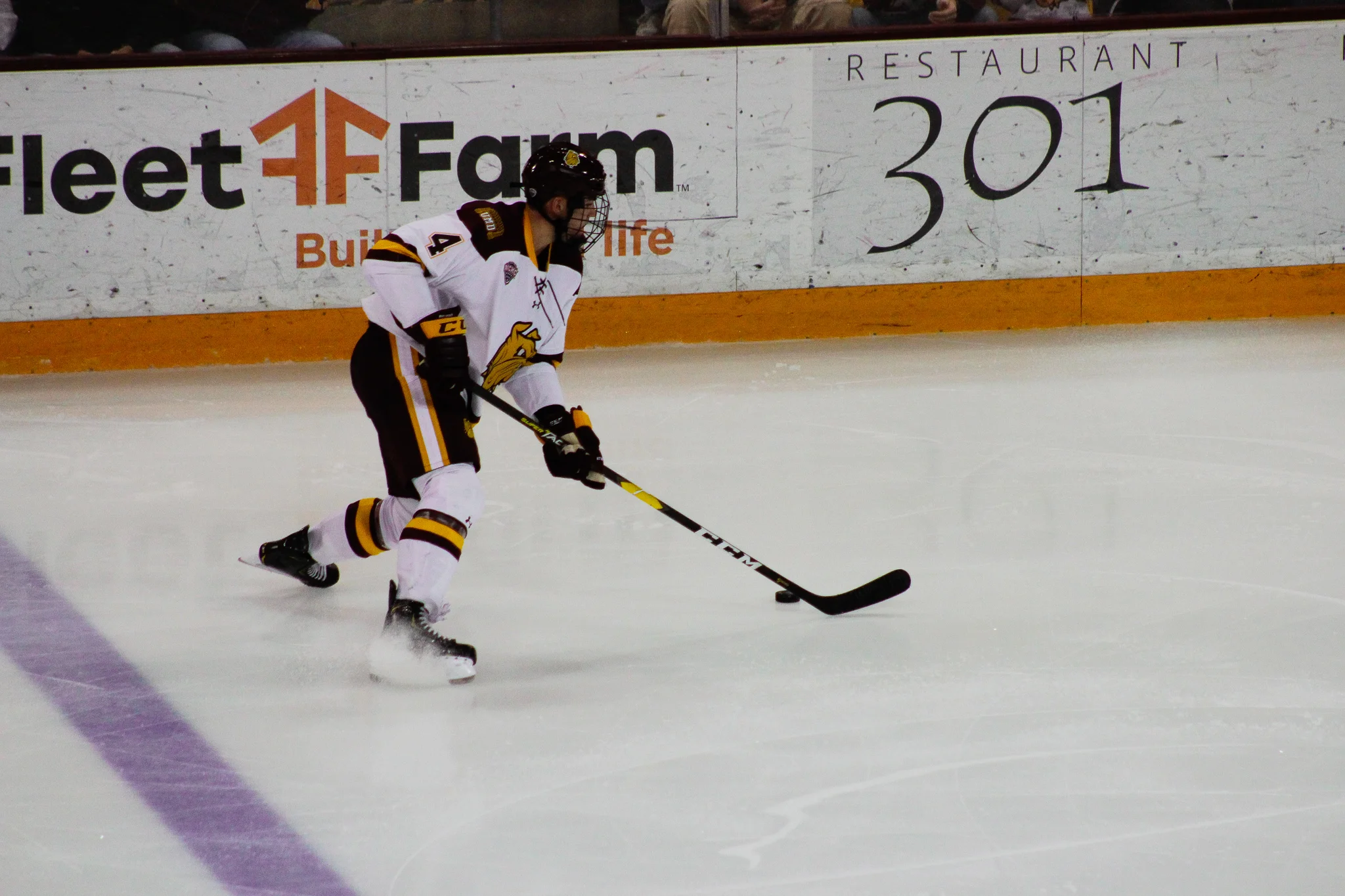 Bulldogs defenseman Dylan Samberg controls the puck during the second period. Photo by: Morgan Pint.