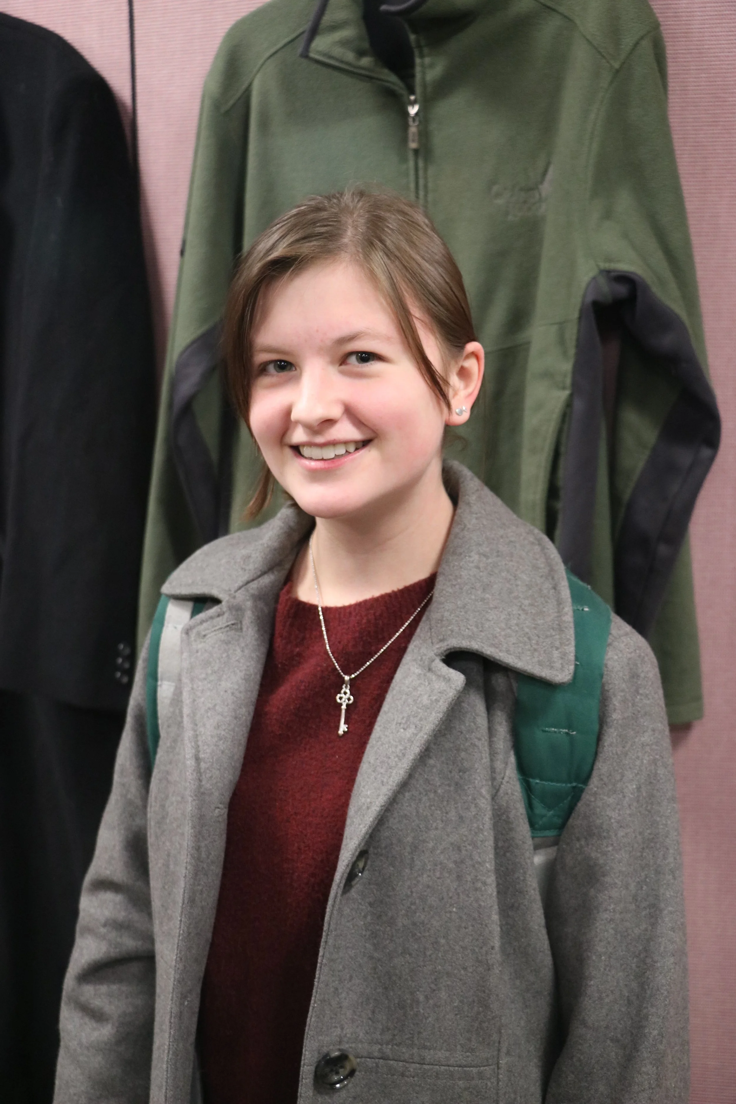 Lexie Ward at the Free Store on Nov. 1, 2018. Ward found a jacket to take home for free at the store. Photo by Rebecca Kottke
