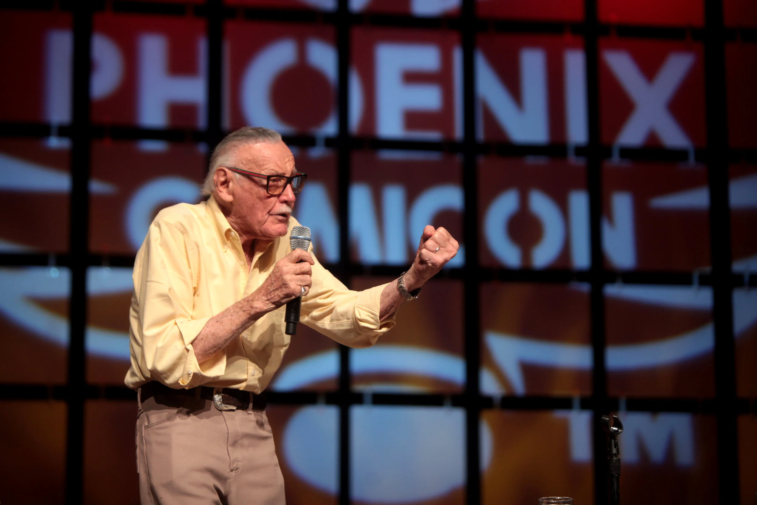 Stan Lee speaking at the 2014 Phoenix Arizona Comicon courtesy Creative Commons. Photo by Gage Skidmore