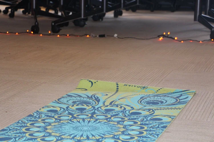 Unrolling the yoga mat and taking up a yoga practice is one way some students find calmness in their day. Photo by Ren Friemann