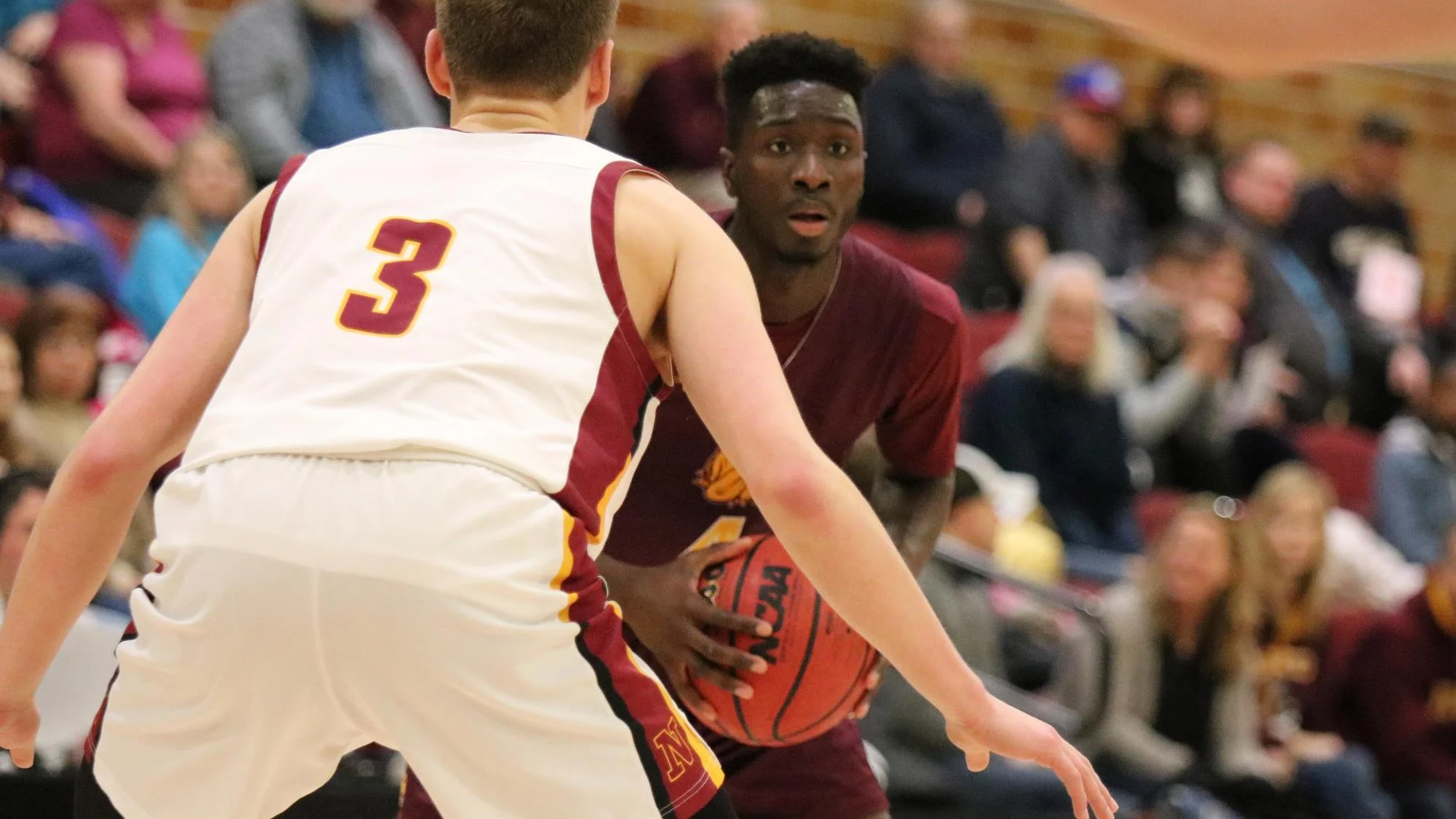 Senior Mamadou Ngom defends against a team member from Northern States. Photo by Drew Smith, courtesy of UMD Athletics