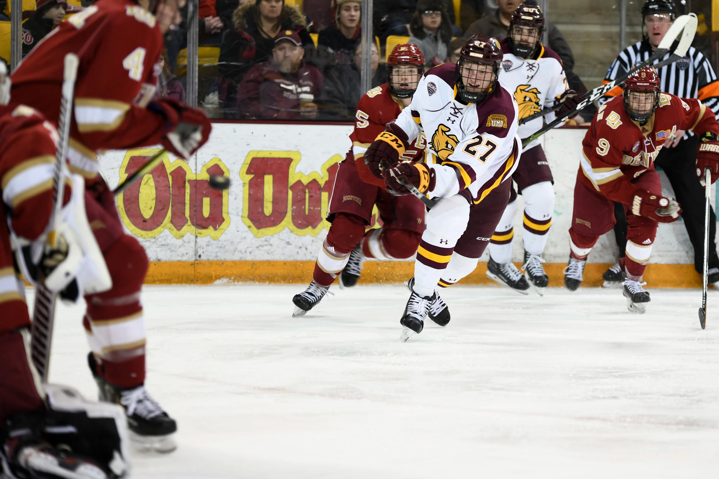 Junior wing Riley Tufte (27) passes the puck Friday night at AMSOIL Arena. Photo: Terry Norton