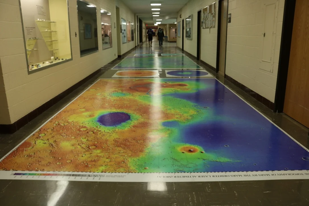 New topography maps of Mars, the Moon, and Venus were installed in Heller Hall. Photo by Madison Hunter