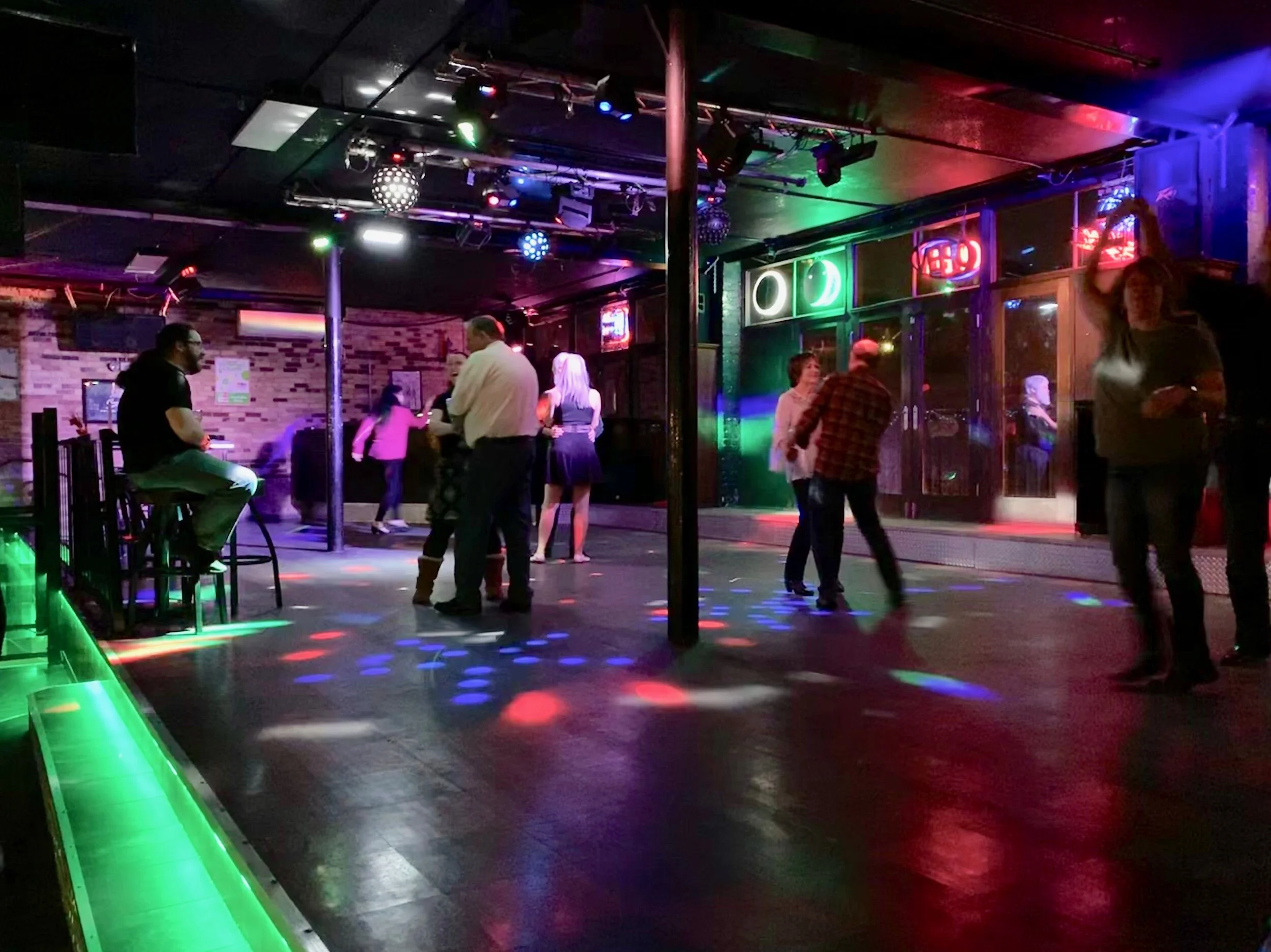 Community members come out every second and fourth Tuesday of each month to swing and line dance at The Flame nightclub. Photo courtesy of Tyra Jaramillo, who accompanied me.