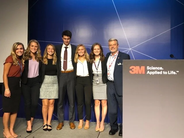 Labovitz School of Business and Economics’ 2019 3M frontline interns with Marketing Instructor John Kratz. Pictured from left to right: Alexa Hilger-Sawochka, Kaylee Wallner, Lizzy Fontes, Charlie Crist, Molly Arbuckl, Eliza Ebel, John Kratz. Photo courtesy of John Kratz