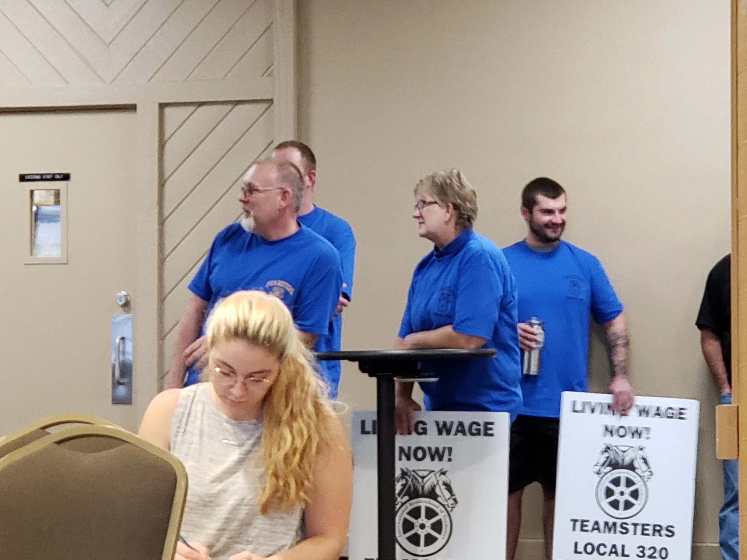 UMD Maintenance workers holding signs and making their presence feel known in the middle of a contract negotiation between them and the University, where they are fighting for better wages and compensation. Photo by Atticus Hodges