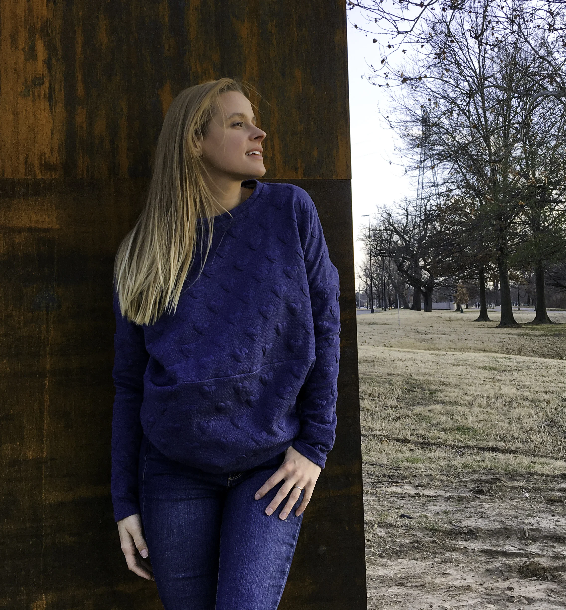 Settling into one of my favorite spots for photos in front of the Gathering Place Tulsa sign.