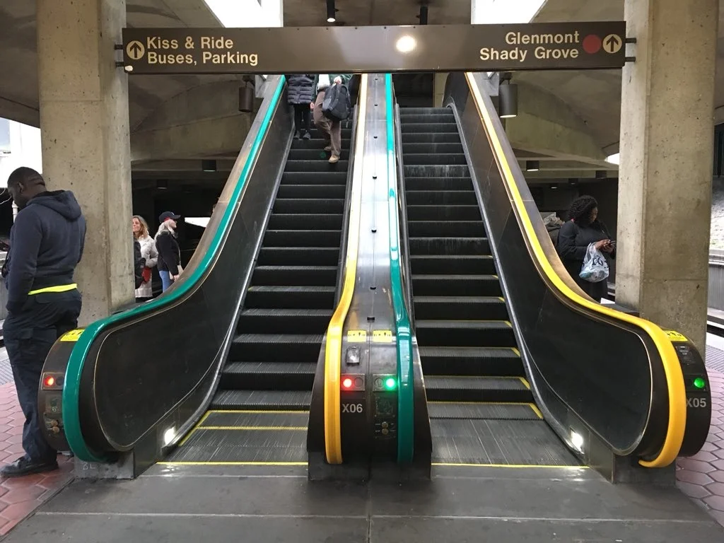 Metro is testing out new color-coded escalator handrails at Fort Totten station