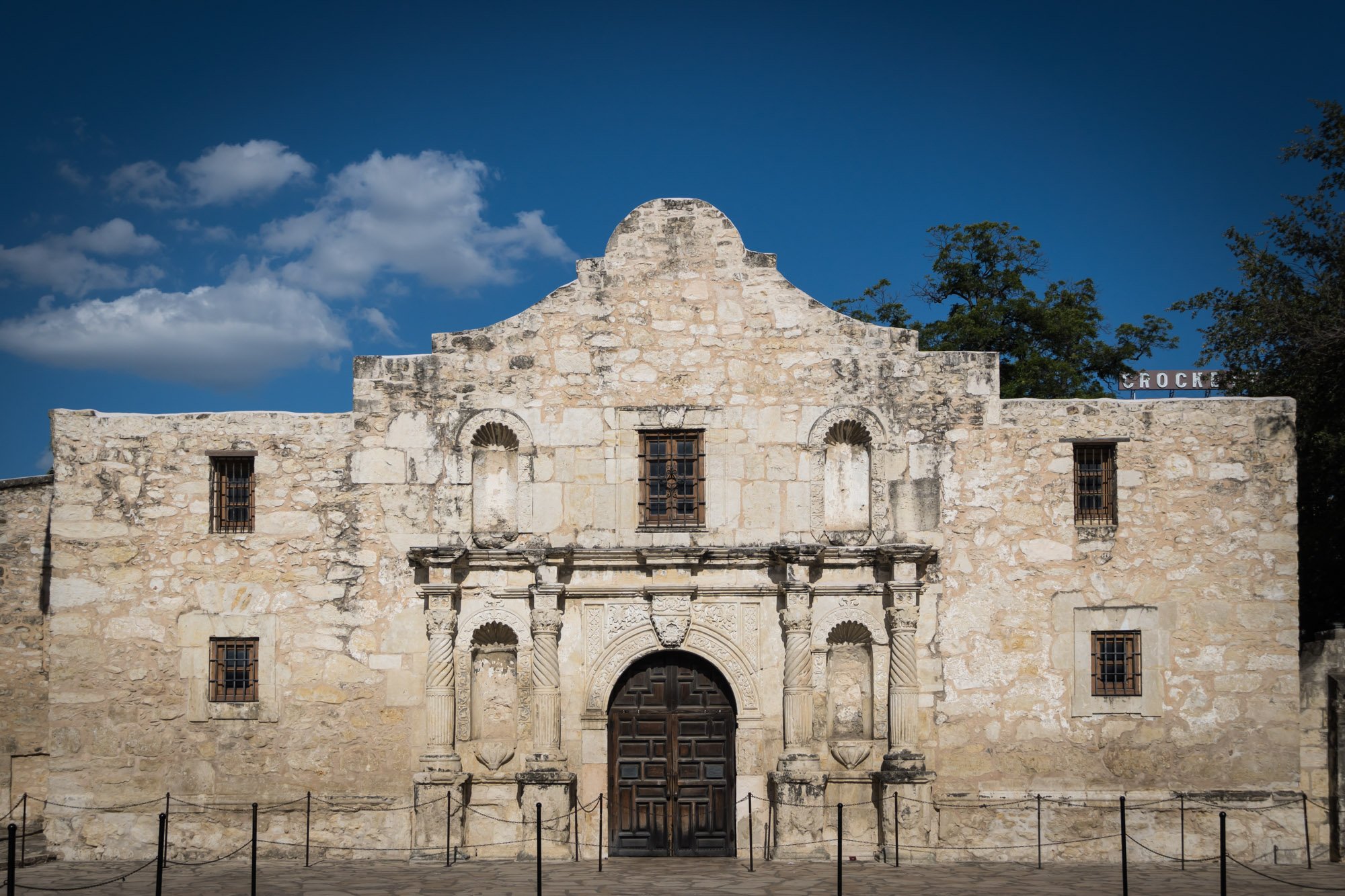 The Alamo with blue sky and clouds by San Antonio travel photographer, Kelly Williams
