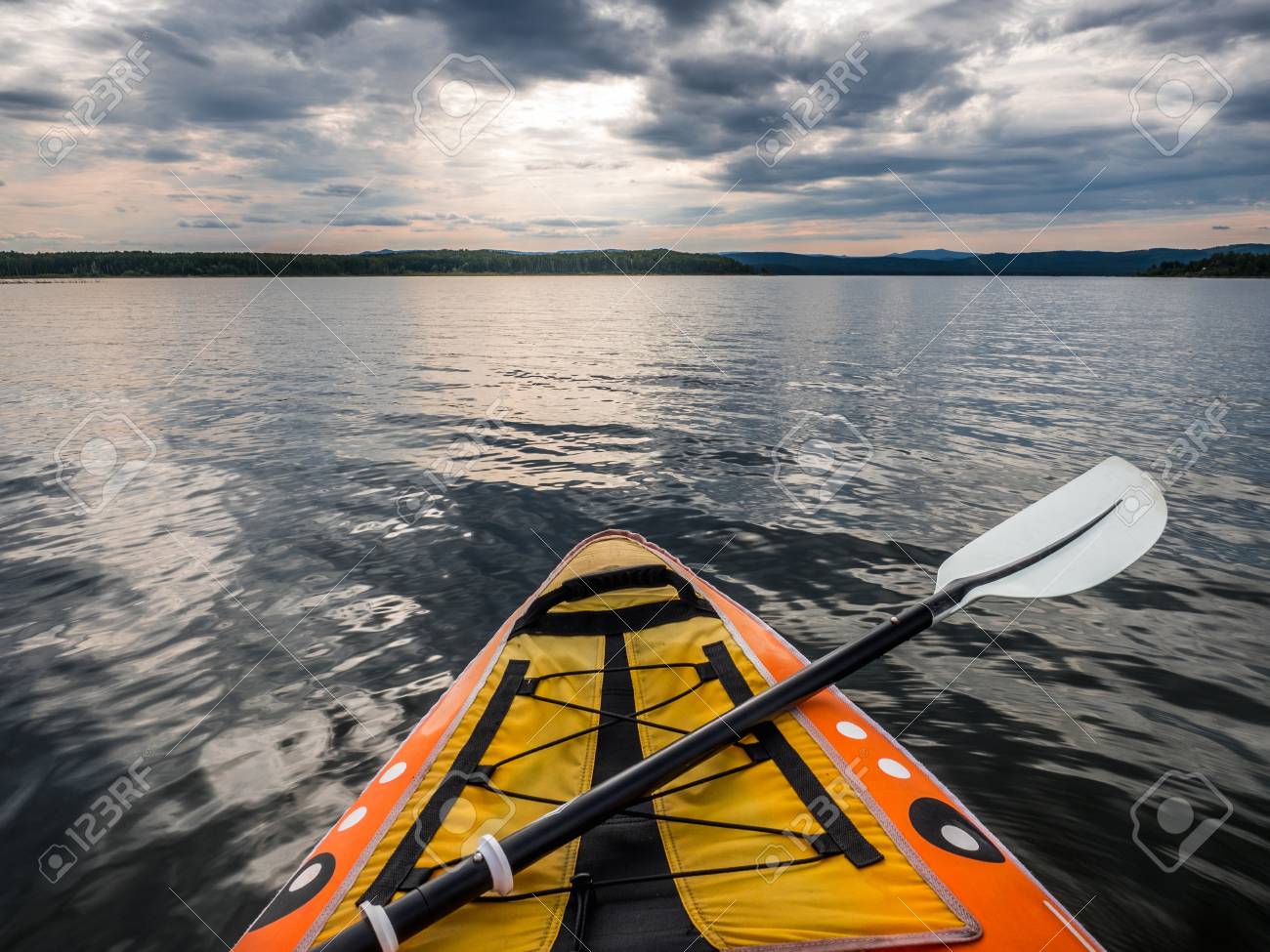 105707365-point-of-view-shot-from-inside-kayak-on-lake-water-.jpg