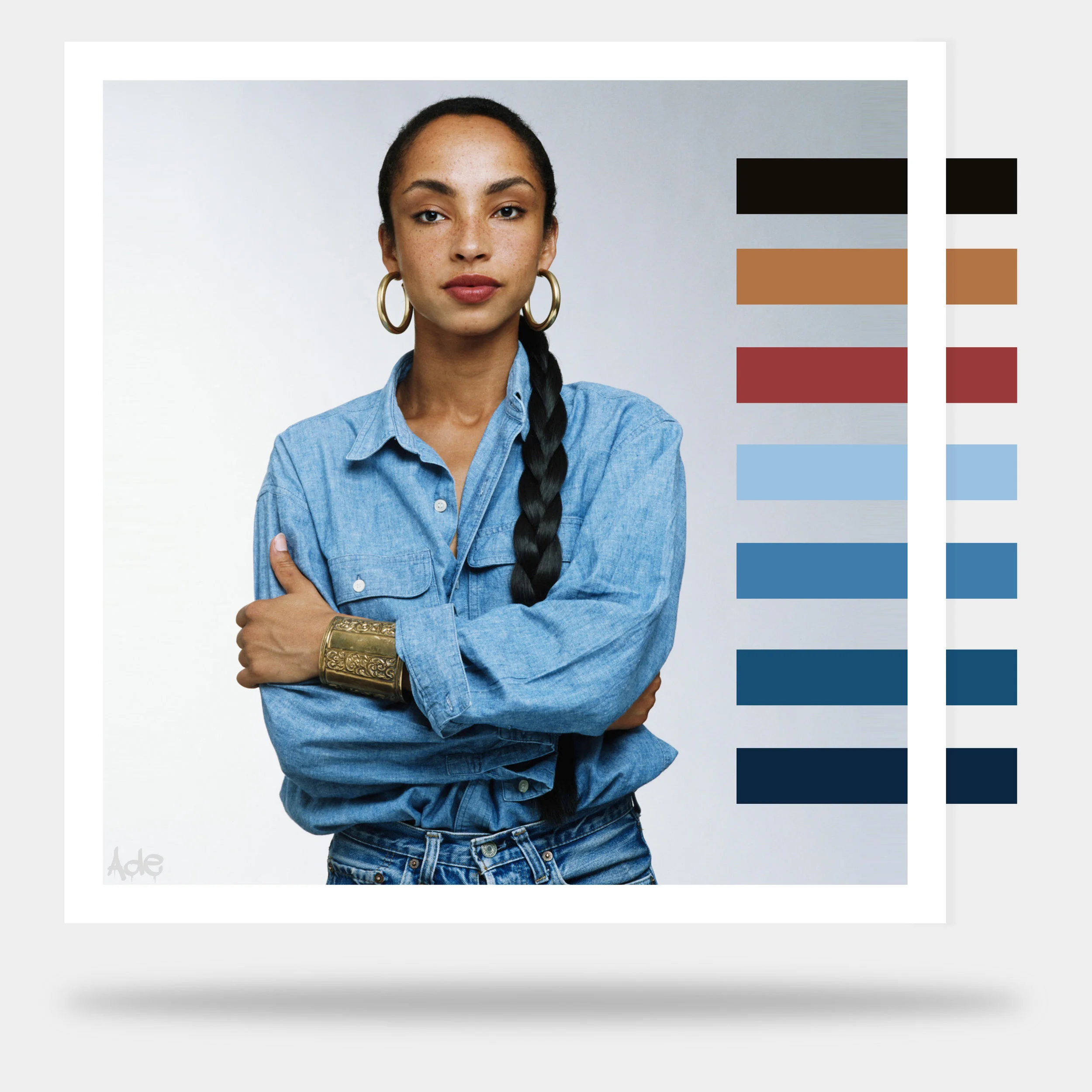 Portrait of Sadwith dark hair in a braid, wearing a denim shirt, gold hoop earrings, and gold cuff bracelet, crossing her arms against a light gray background, accompanied by a color palette with black, beige, red, light blue, and navy blue swatches.