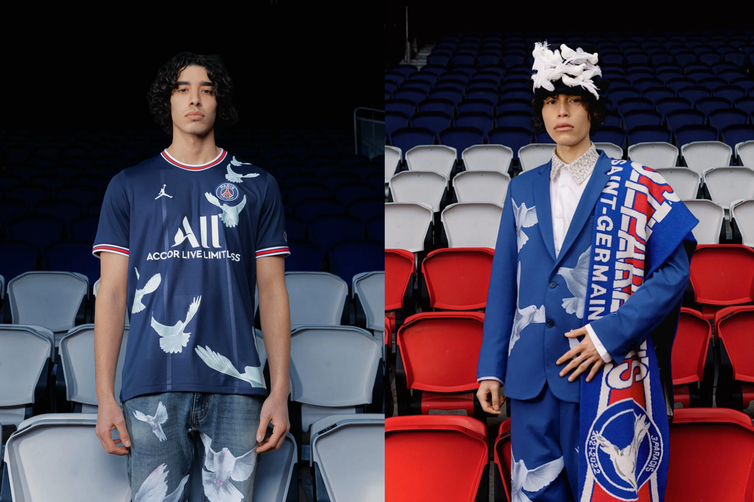 Two young men standing in stadium seats, each wearing a blue outfit with white bird patterns. The man on the left wears a Paris Saint-Germain football jersey and jeans, while the man on the right wears a blue suit with a white shirt, a scarf, and a h