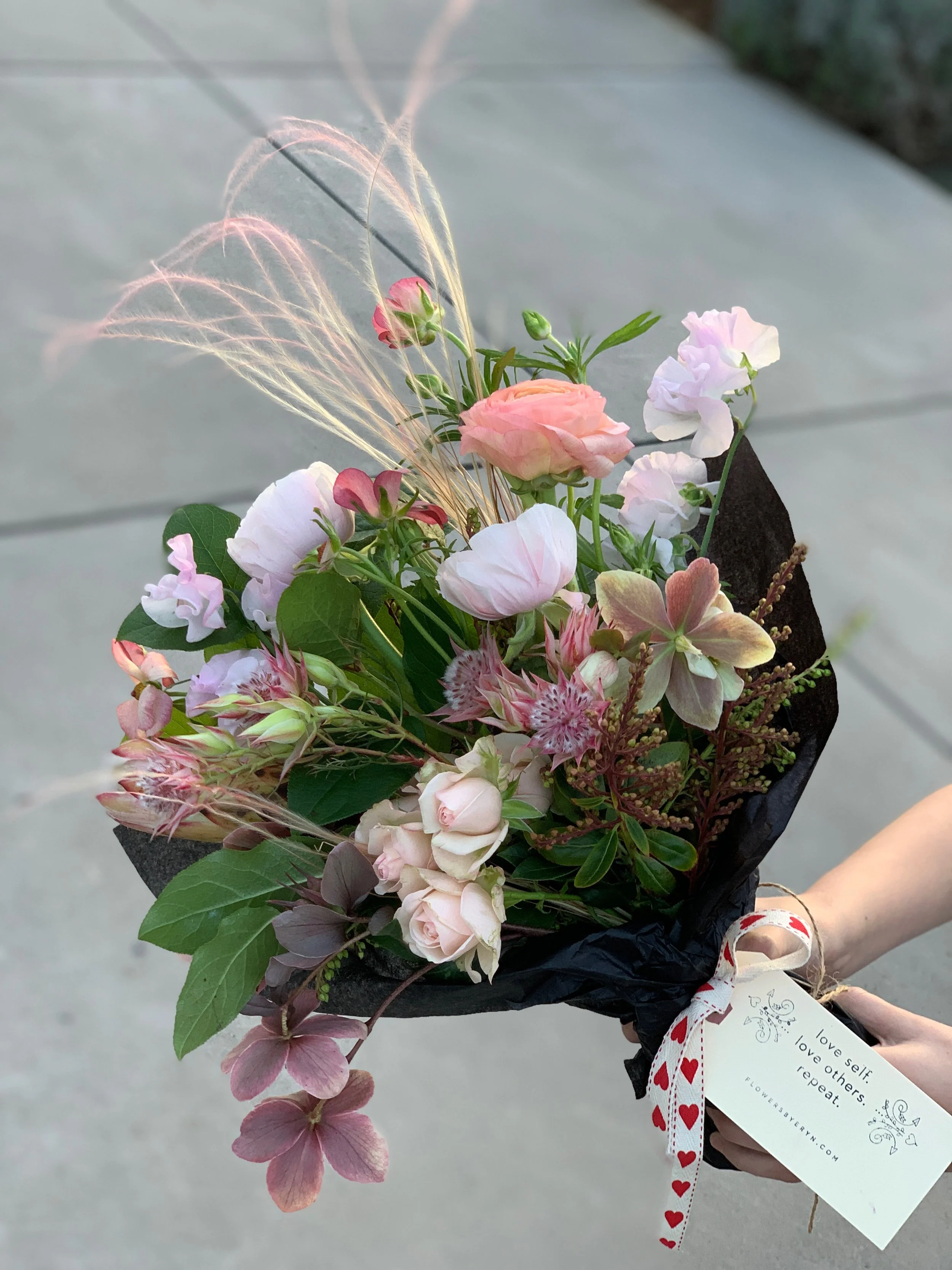 Valentine's Day wrapped bouquet with pink flowers from Flowers by Eryn in Bend