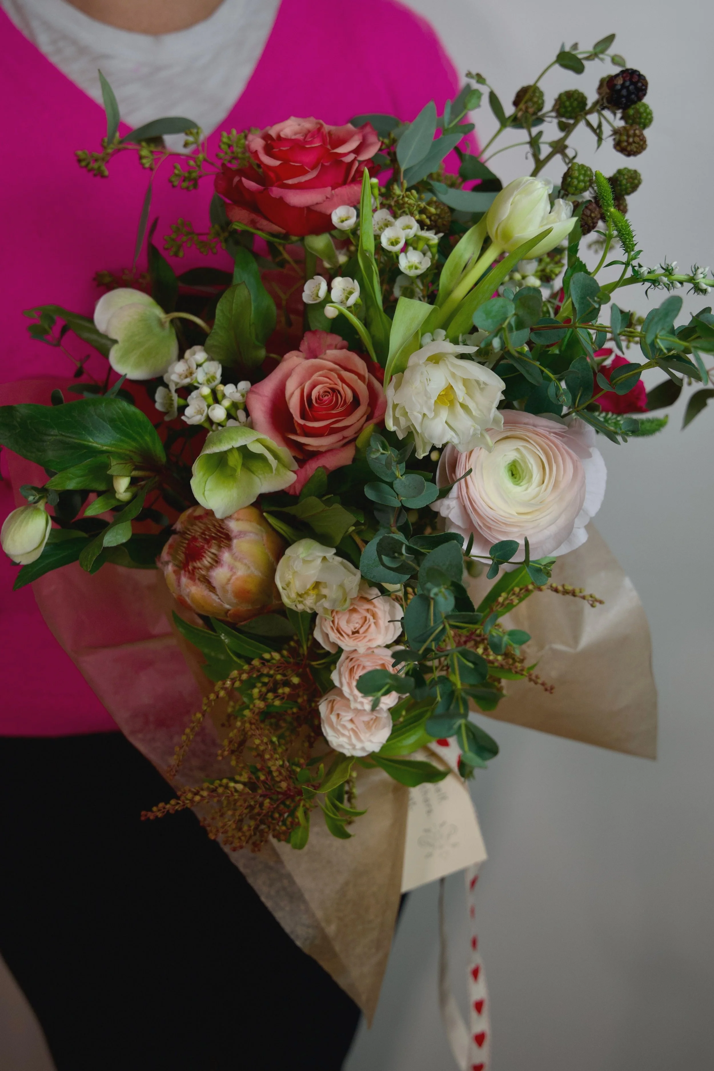 Valentine's Day wrapped bouquet with roses from Flowers by Eryn in Bend