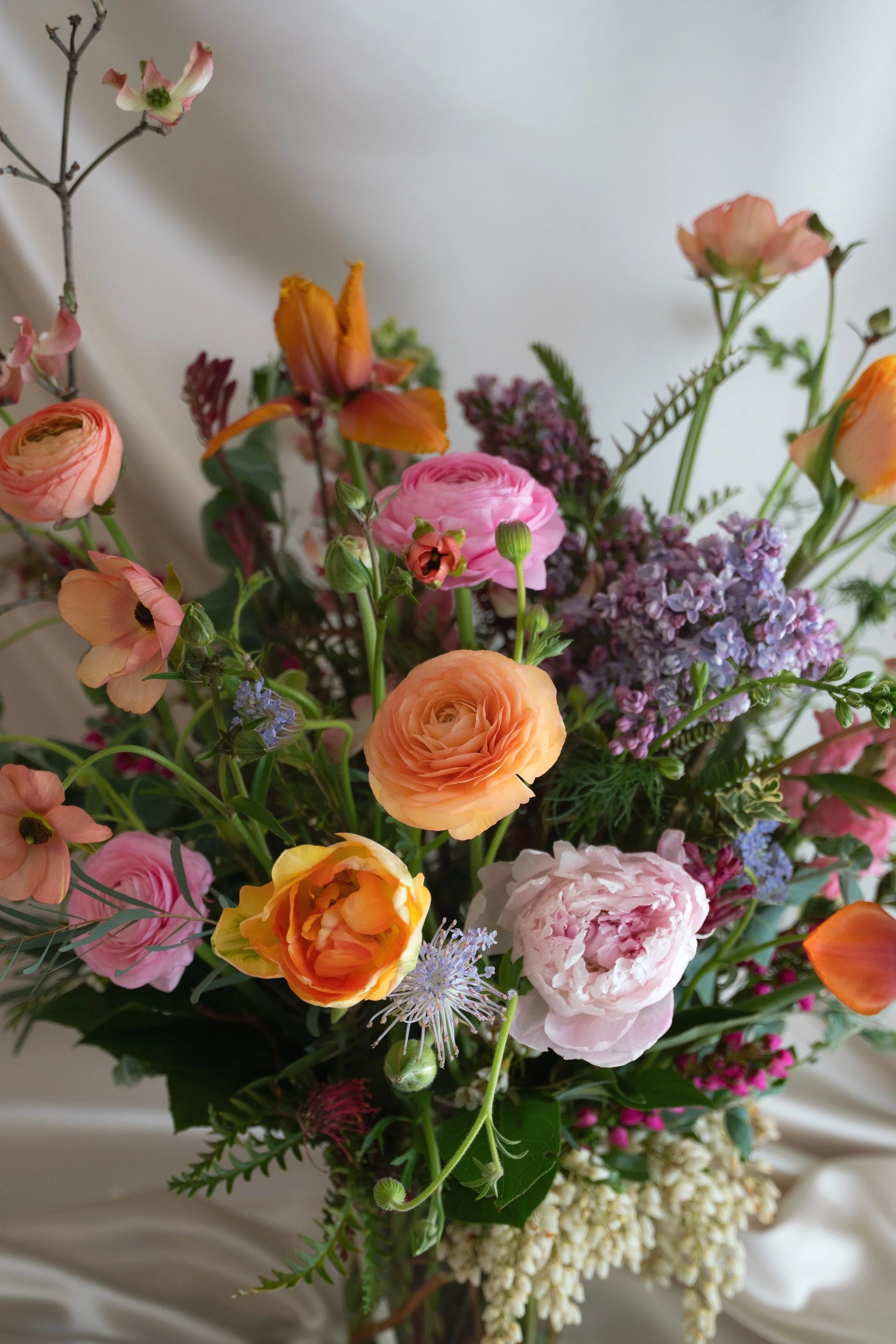 Coral, pink, and lavender flowers in a Mother's Day flower bouquet