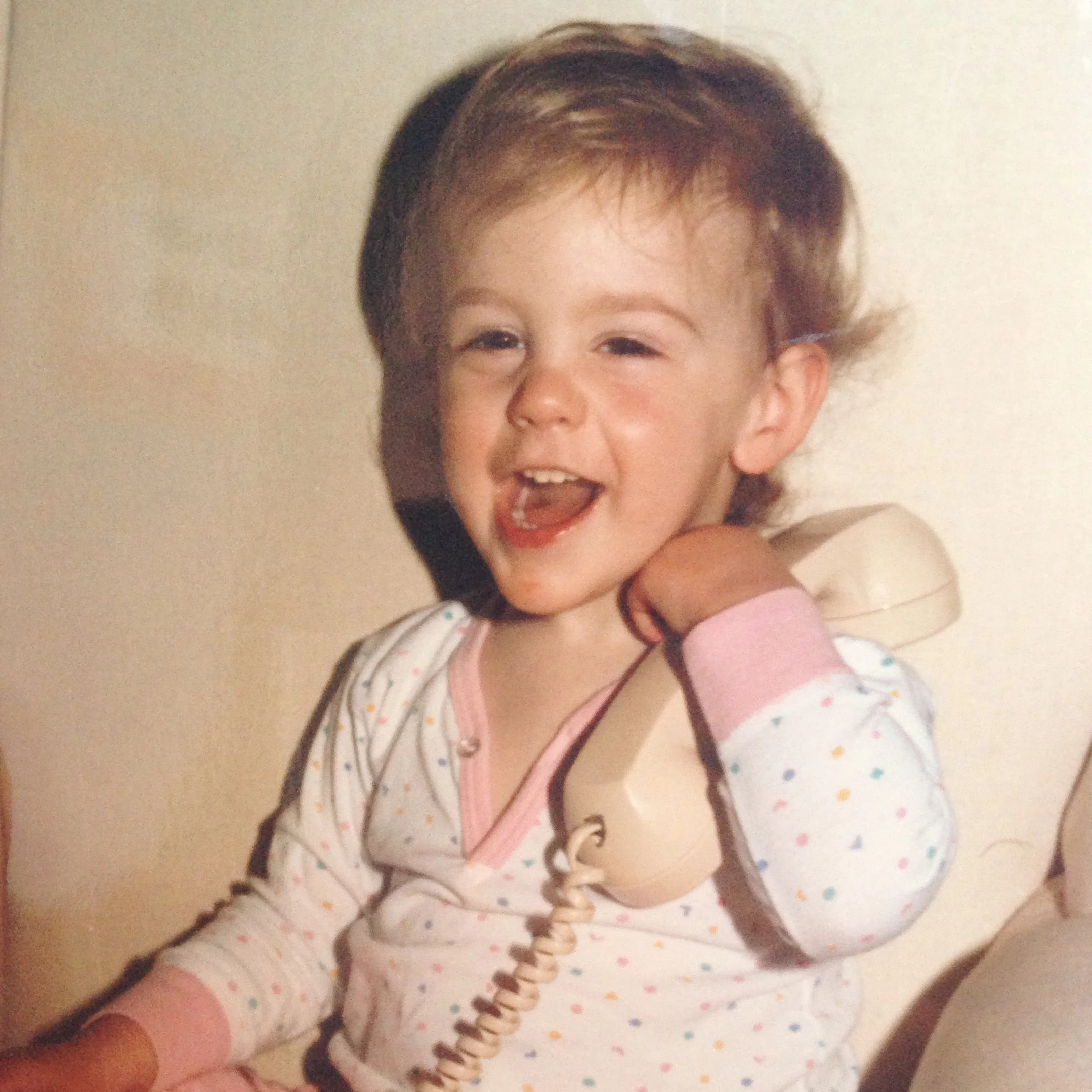 Hey, Future Bev! One day you'll own your own apartment and this phone photo will date you in a big way, You will also still make the same faces that you did when you were two.