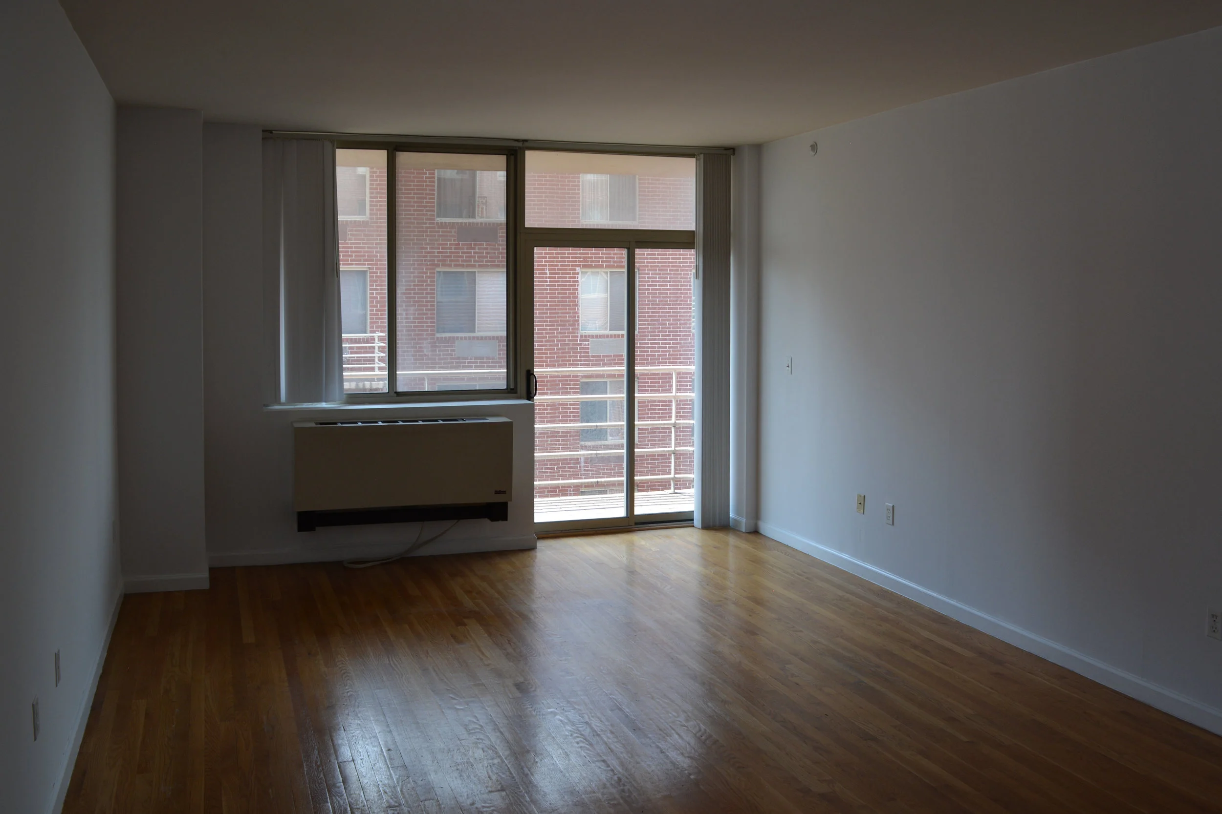 The window had not been cleaned in a very long time, which made the room feel much darker than it does now. The AC unit was the focal point of the room....which was unfortunate.