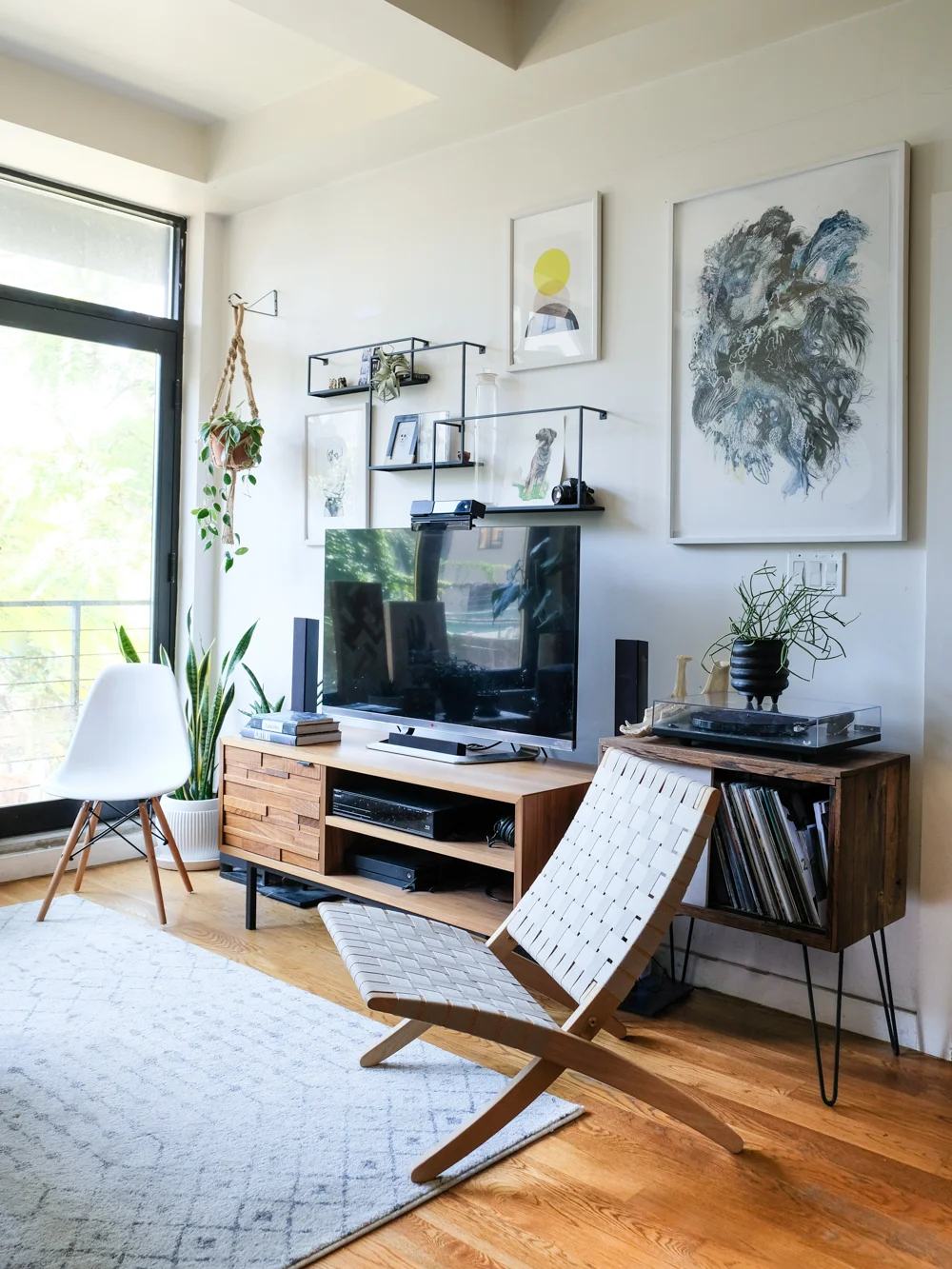 Decorating around a TV is always challenging, but gallery wall is a nice way for it to blend in.
