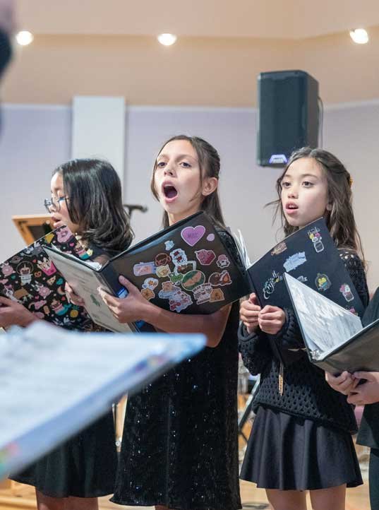 Young girls taking youth choir lessons at West Coast Music Academy in Santa Clarita