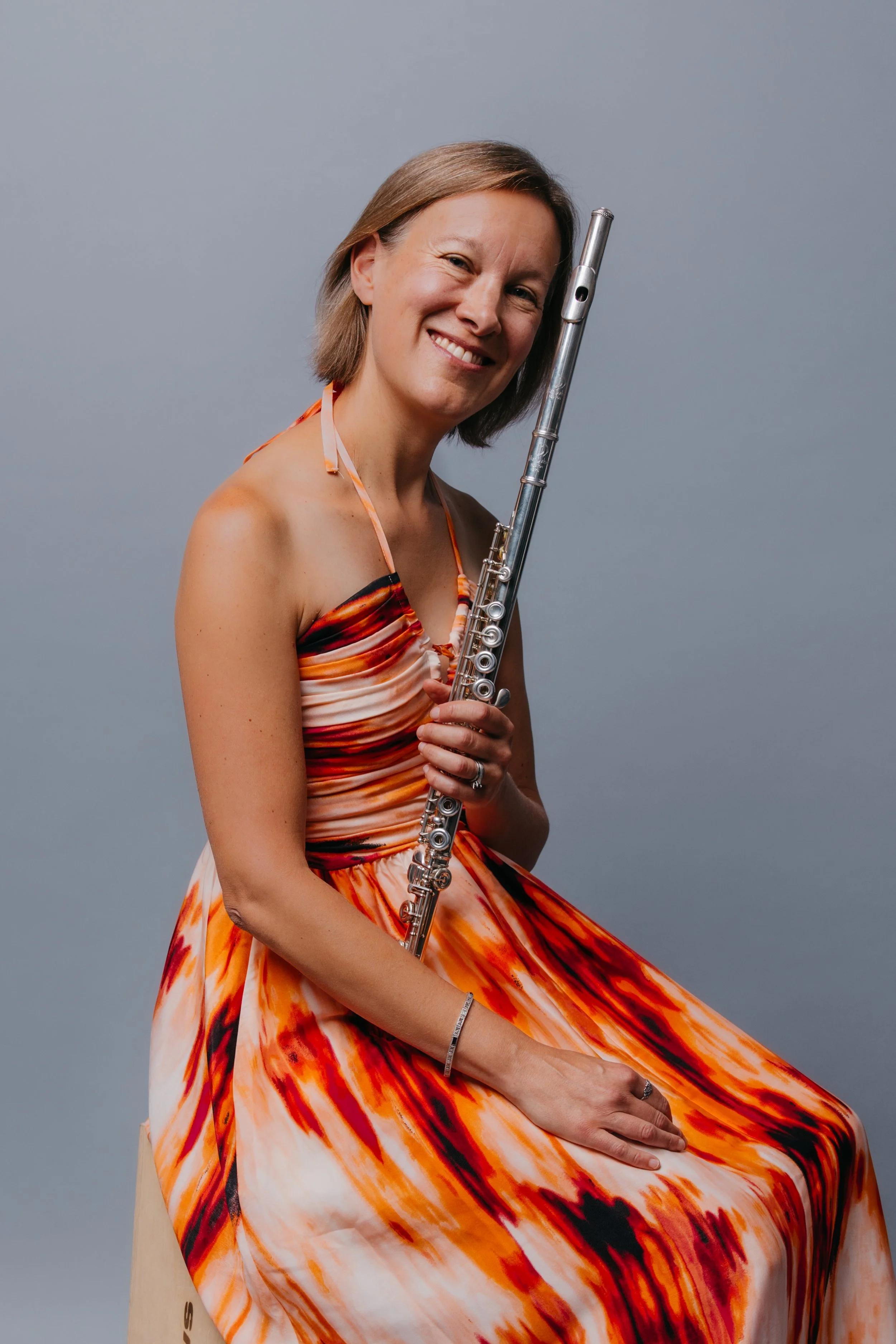 Barth orange dress sitting Bryant 2024.jpg