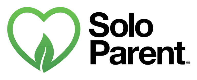 A black emblem featuring a green heart with a leaf inside it.