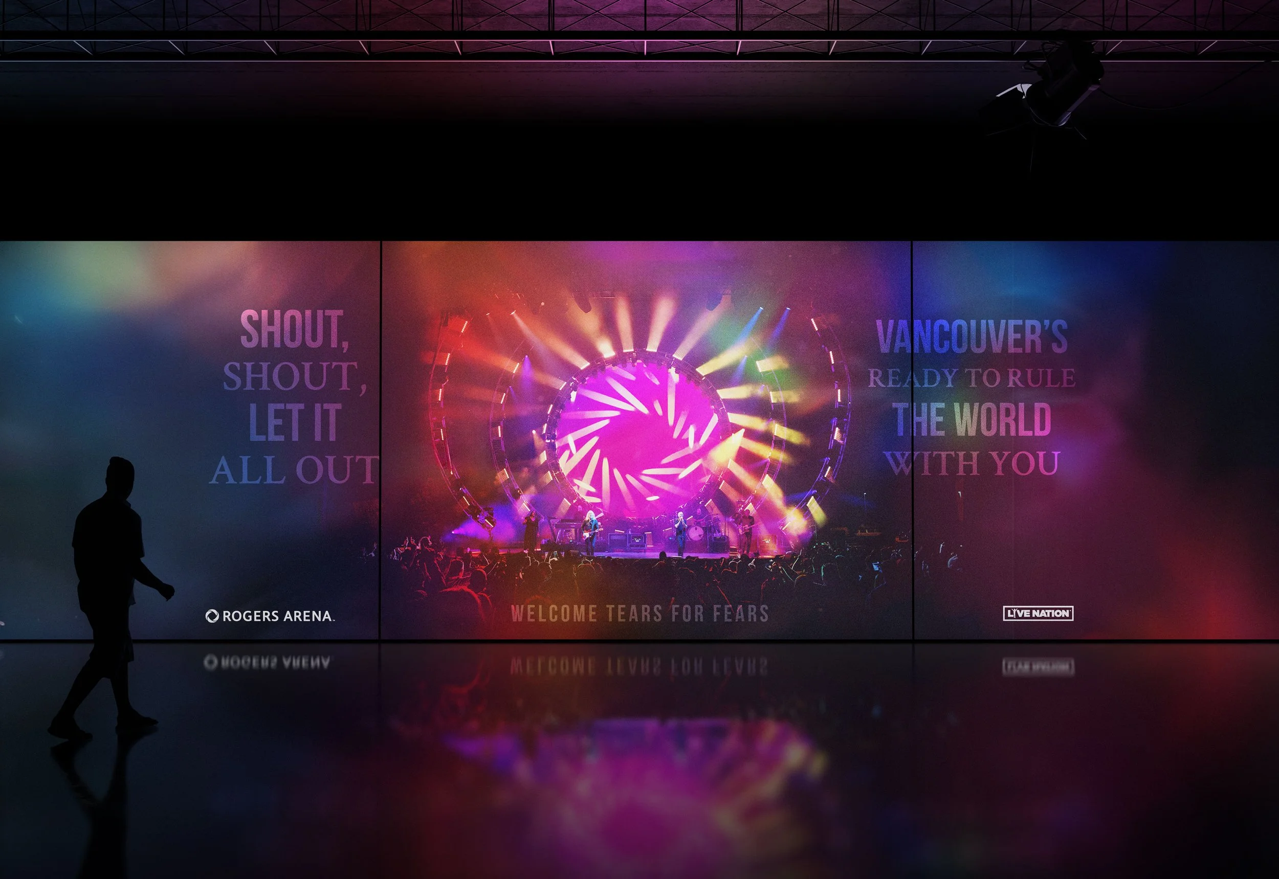 Colorful concert stage with bright lights and text on screen, "Shout, shout, let it all out" and "Vancouver's ready to rule the world with you." Venue is Rogers Arena. Welcome message for Tears for Fears. Silhouette of person walking by.