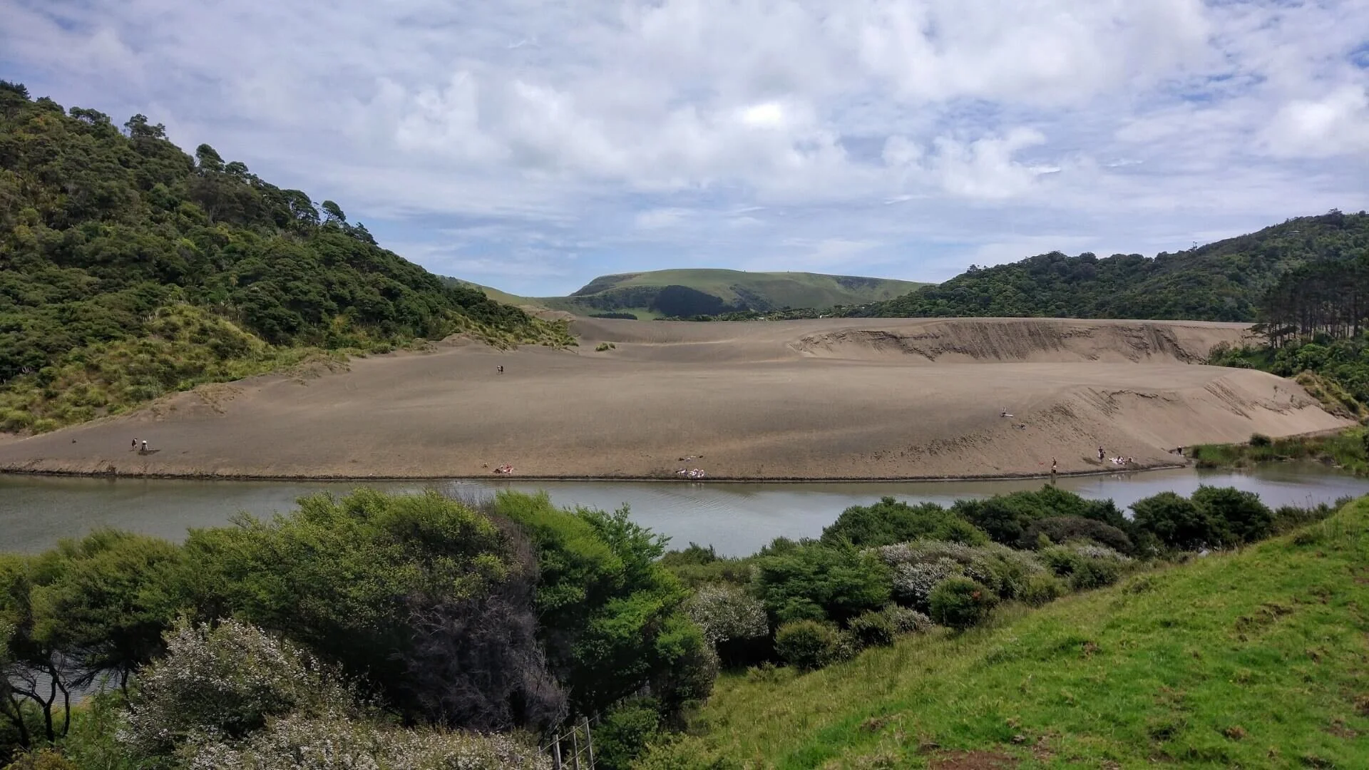 How To Explore Lake Wainamu And Surf A Sand Dune