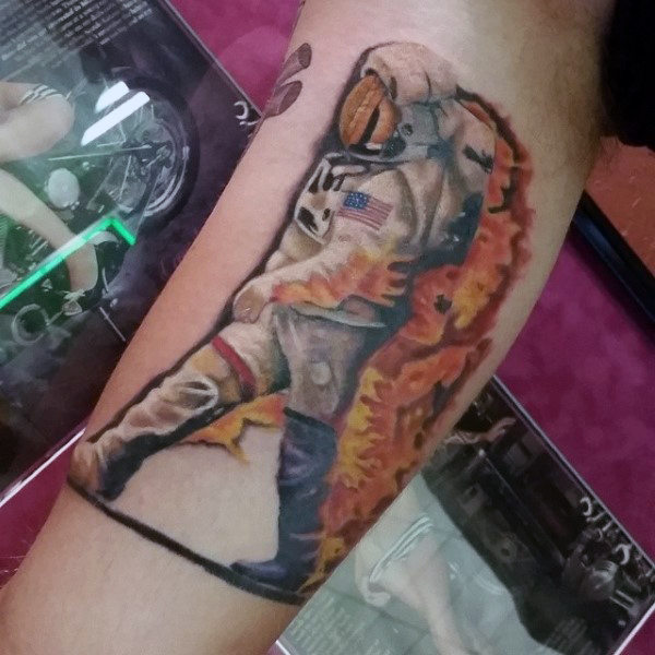 astronaut-on-fire-tattoo-mens-arms.jpg