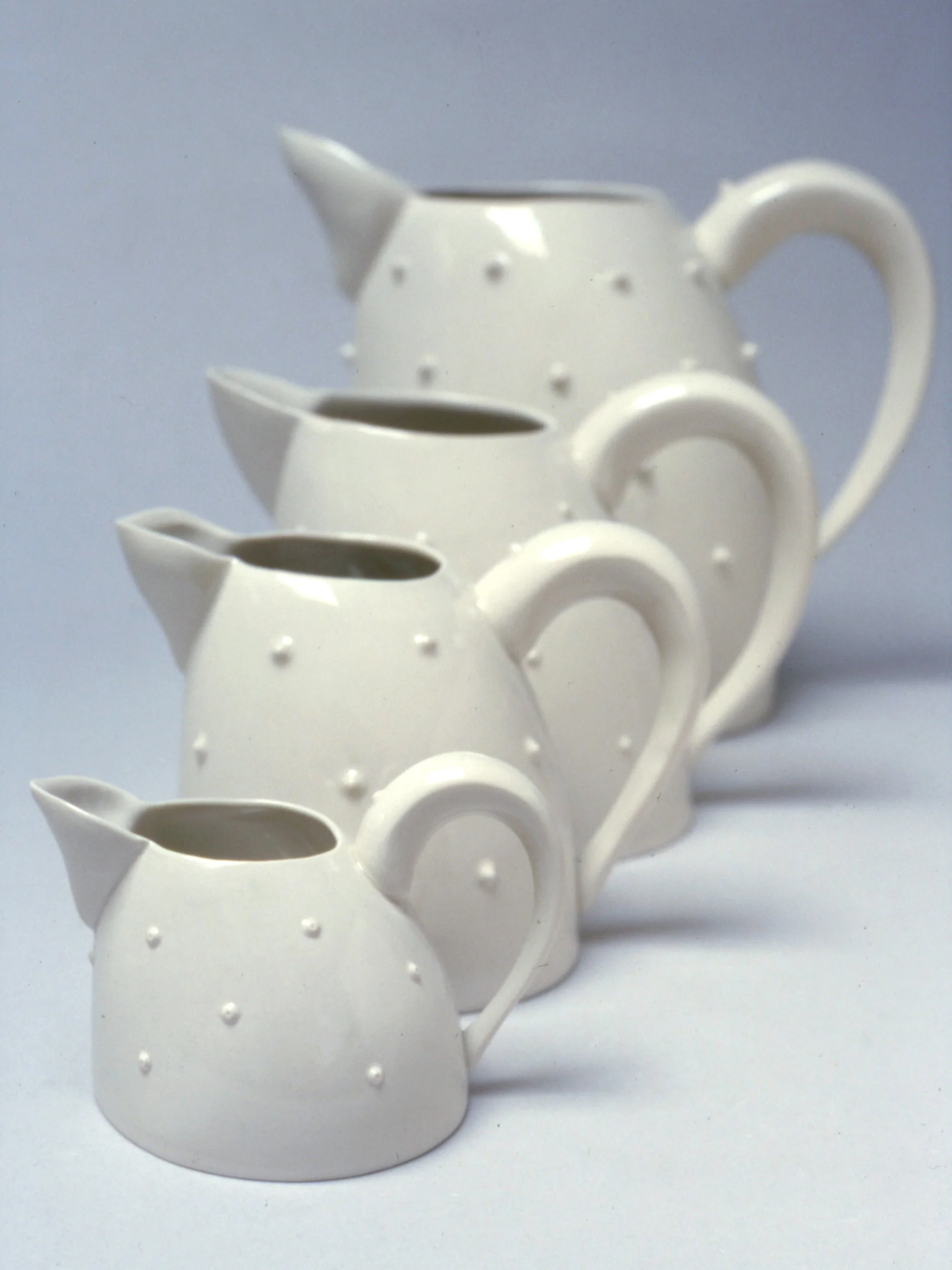 Move Jugs, 1999 - 2007. Slip-cast semi-porcelain and sprigs